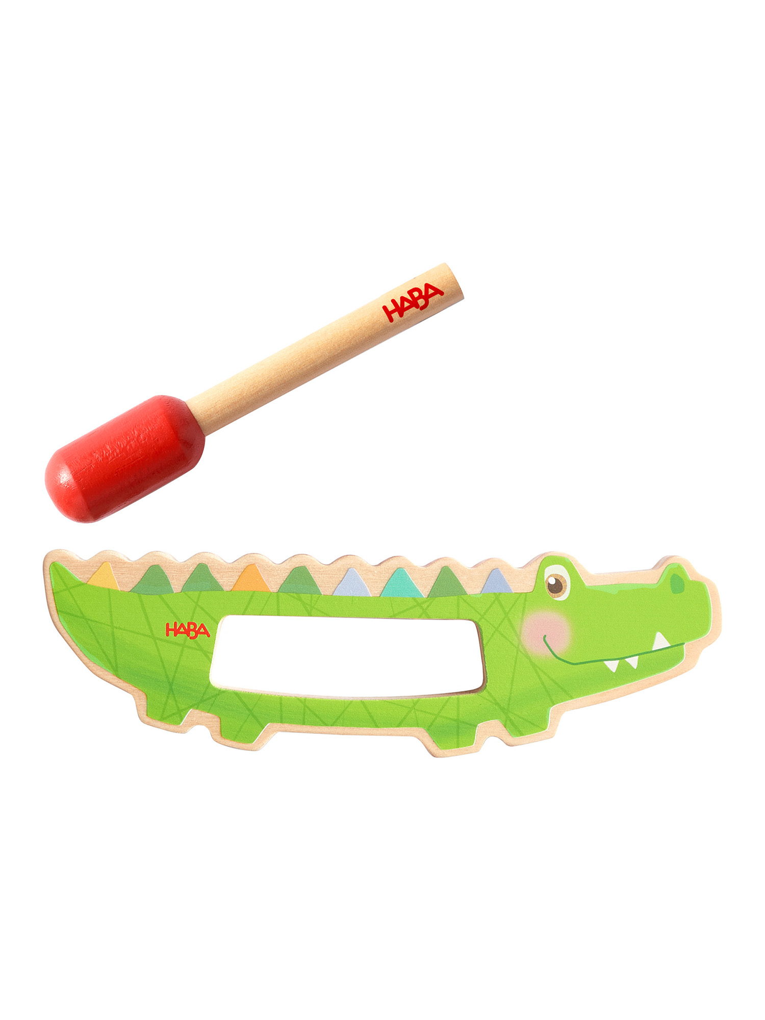 Ein grünes Krokodilspielzeug mit rotem Schlägel. Das Spielzeug hat ein Loch.