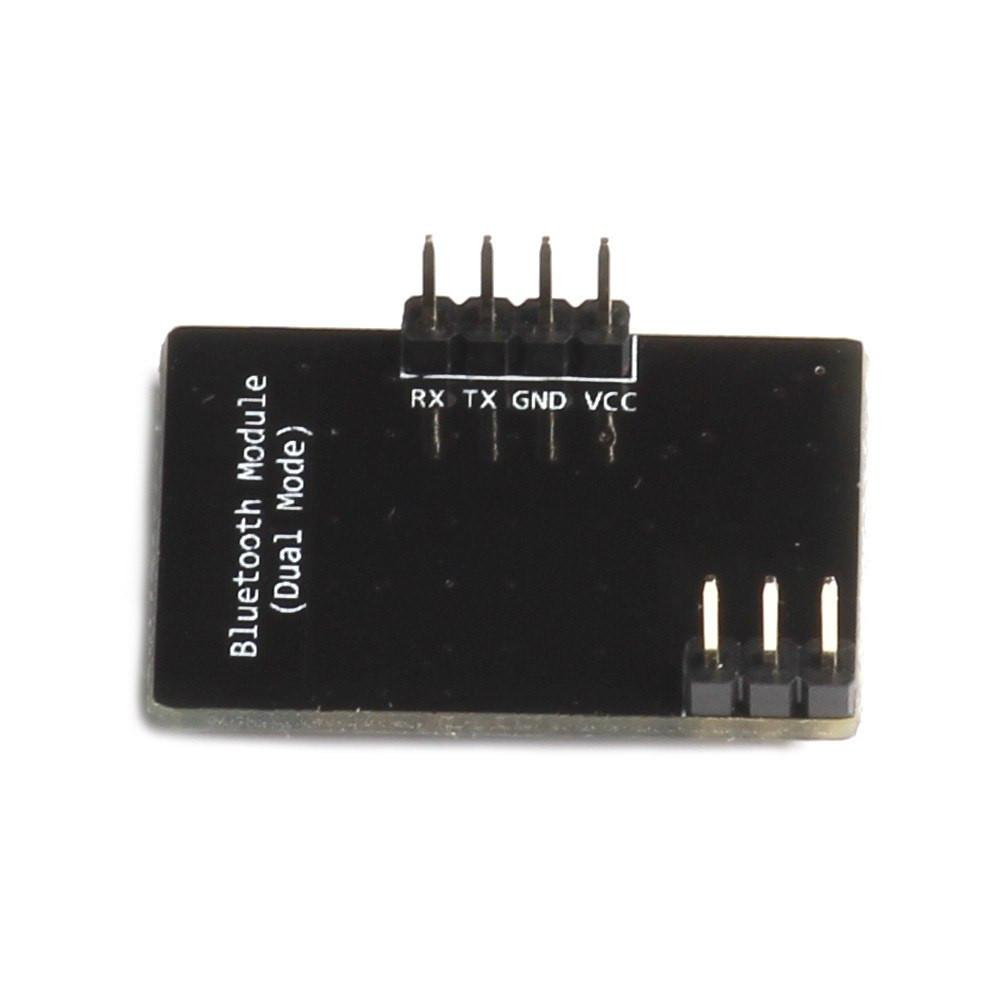 Mały, czarny moduł Bluetooth z pinami. Tekst na nim to Moduł Bluetooth (Tryb podwójny).
