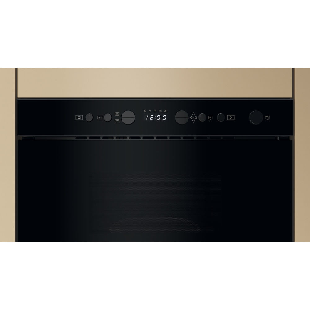 Pannello di controllo del forno a microonde nero con pulsanti e un display digitale che mostra l'ora. Colore neutro.