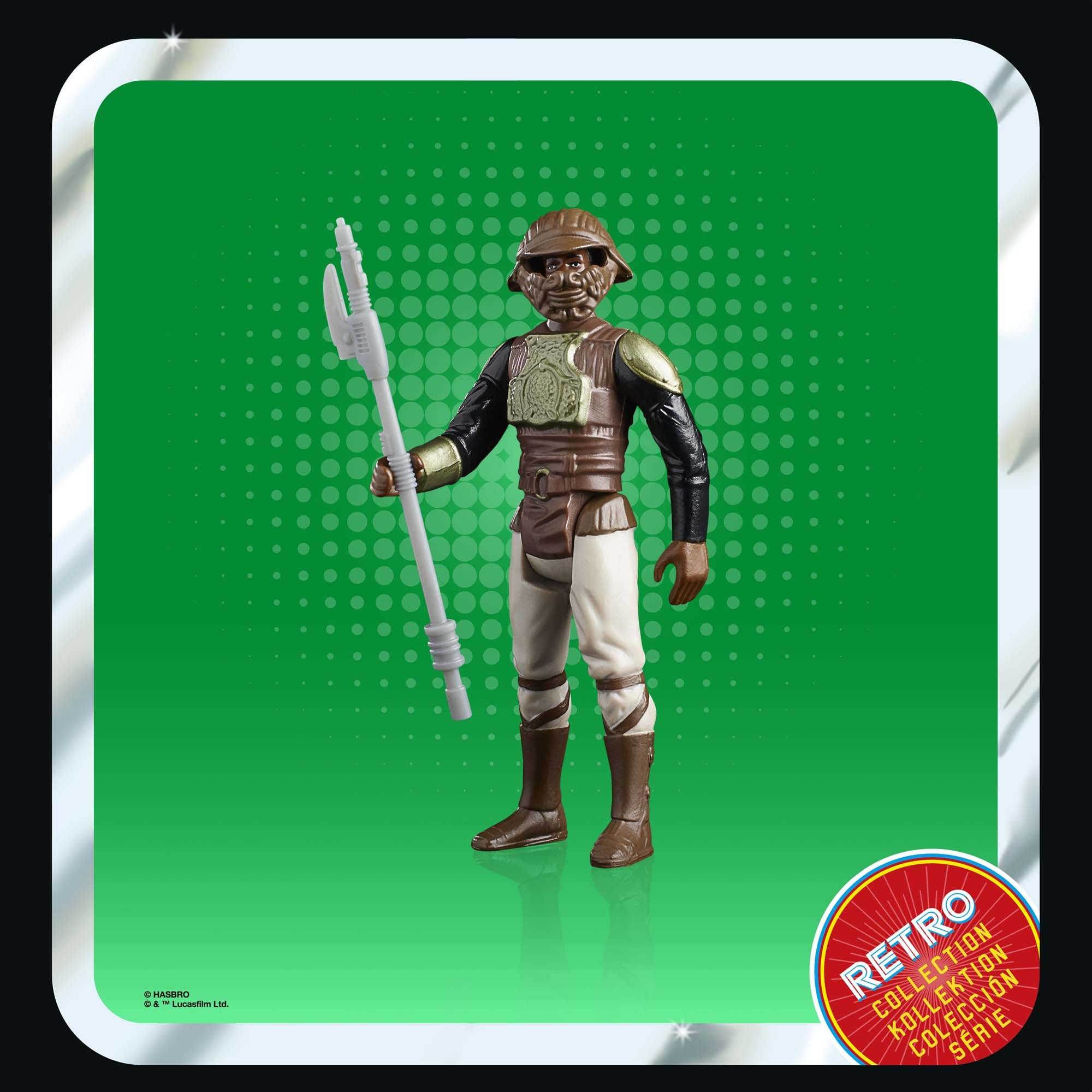 Figura di Star Wars di un Tusken Raider con bastone gaffi, abiti marroni. Sfondo verde.
