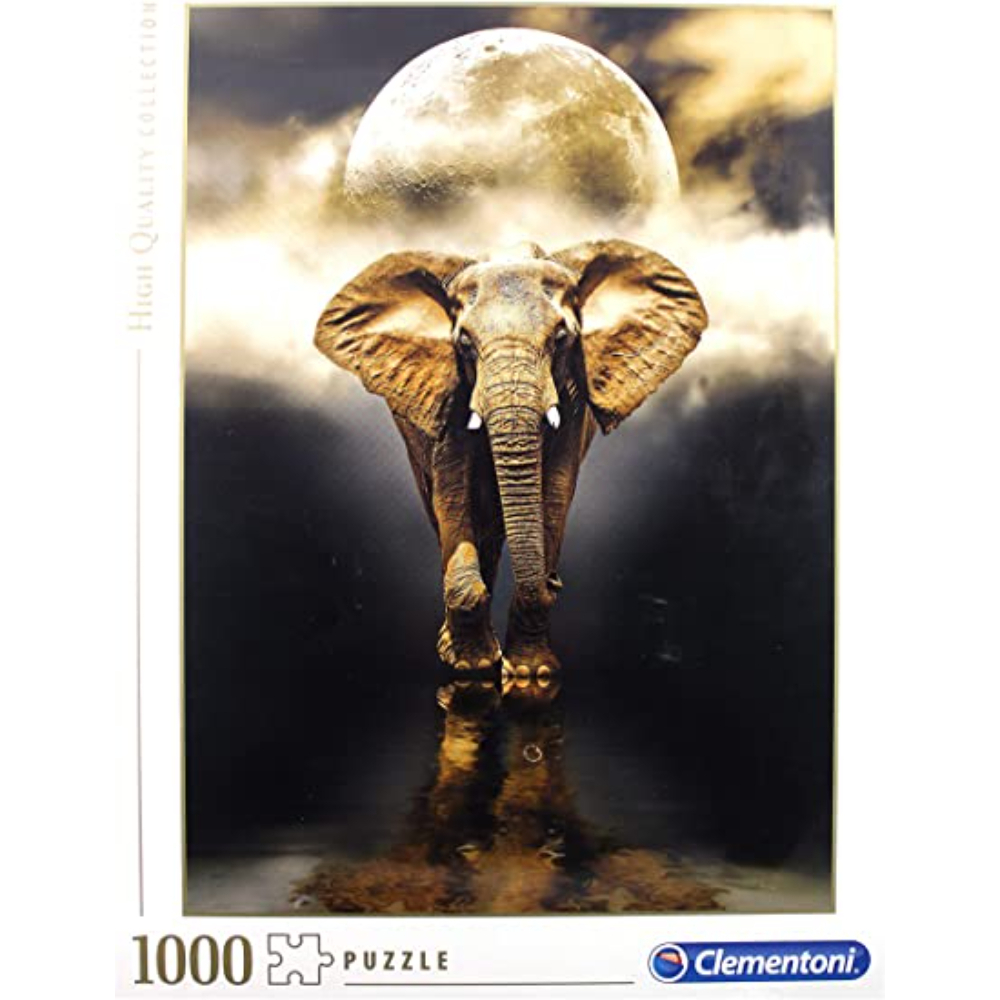Eine Puzzledose mit einem Elefanten vor einem Mond und einer Spiegelung im Wasser.