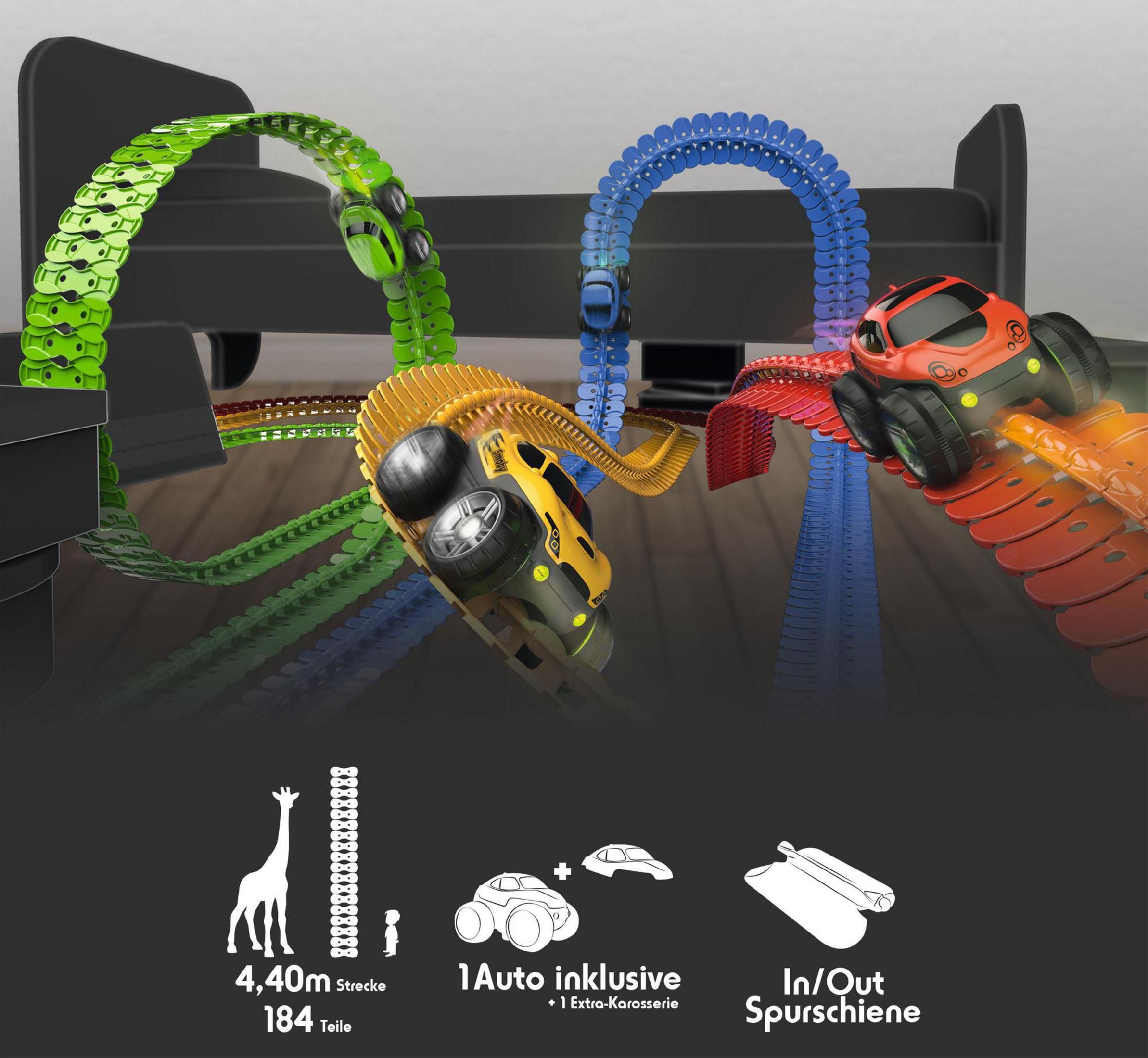 Trzy zabawki samochodowe na torach w kolorach zielonym, żółtym i niebieskim. Etykiety tekstowe znajdują się na dole.