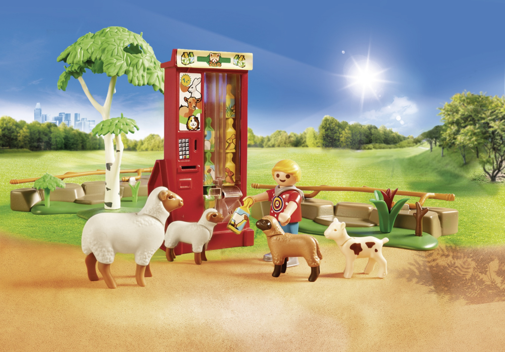 Playmobil-Set mit Figuren, Schafen und einem Automaten in einer Parkumgebung. Grünes Gras im Hintergrund.
