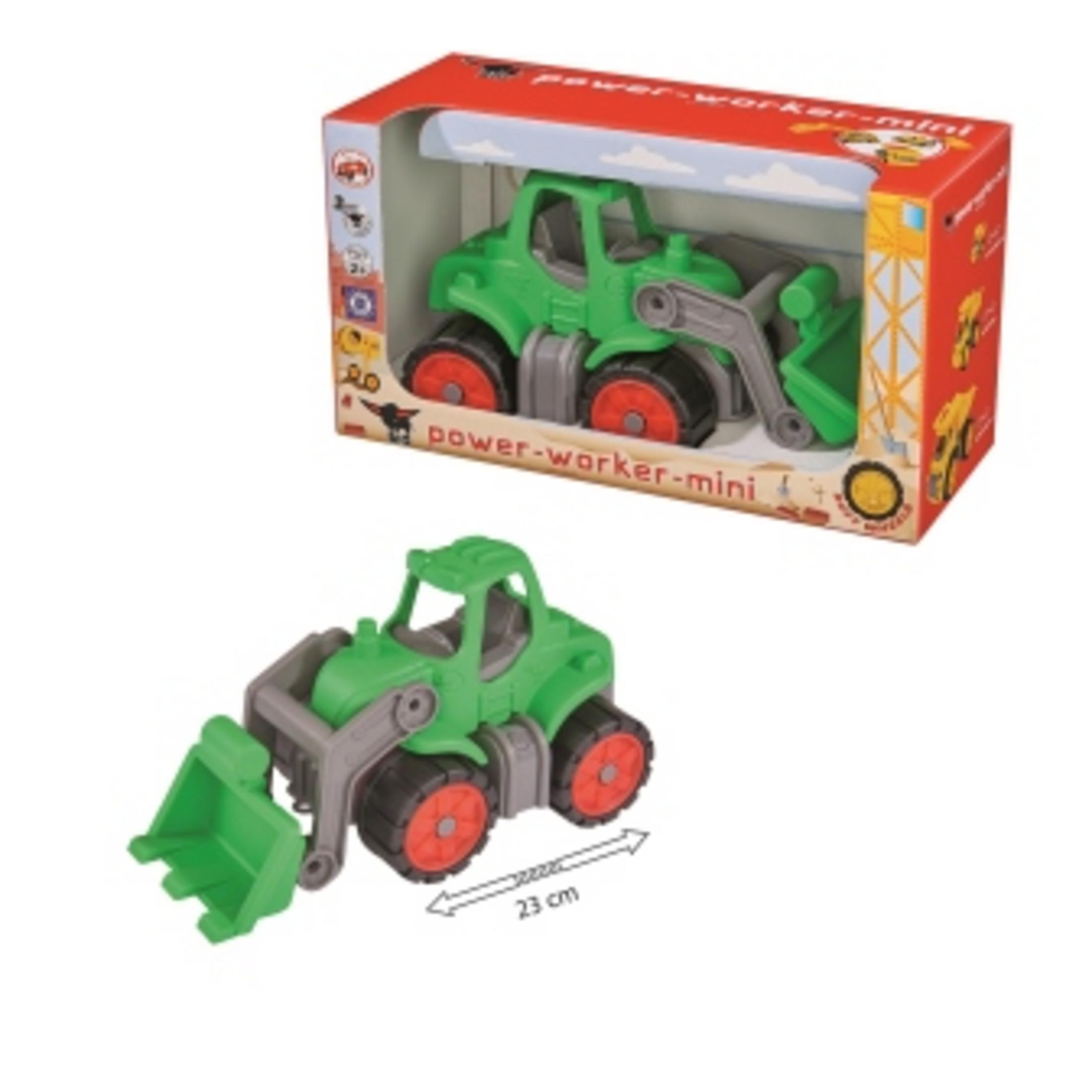 Zielony traktor zabawkowy w pudełku. Pudełko pokazuje traktor i ma tekst w wielu językach.