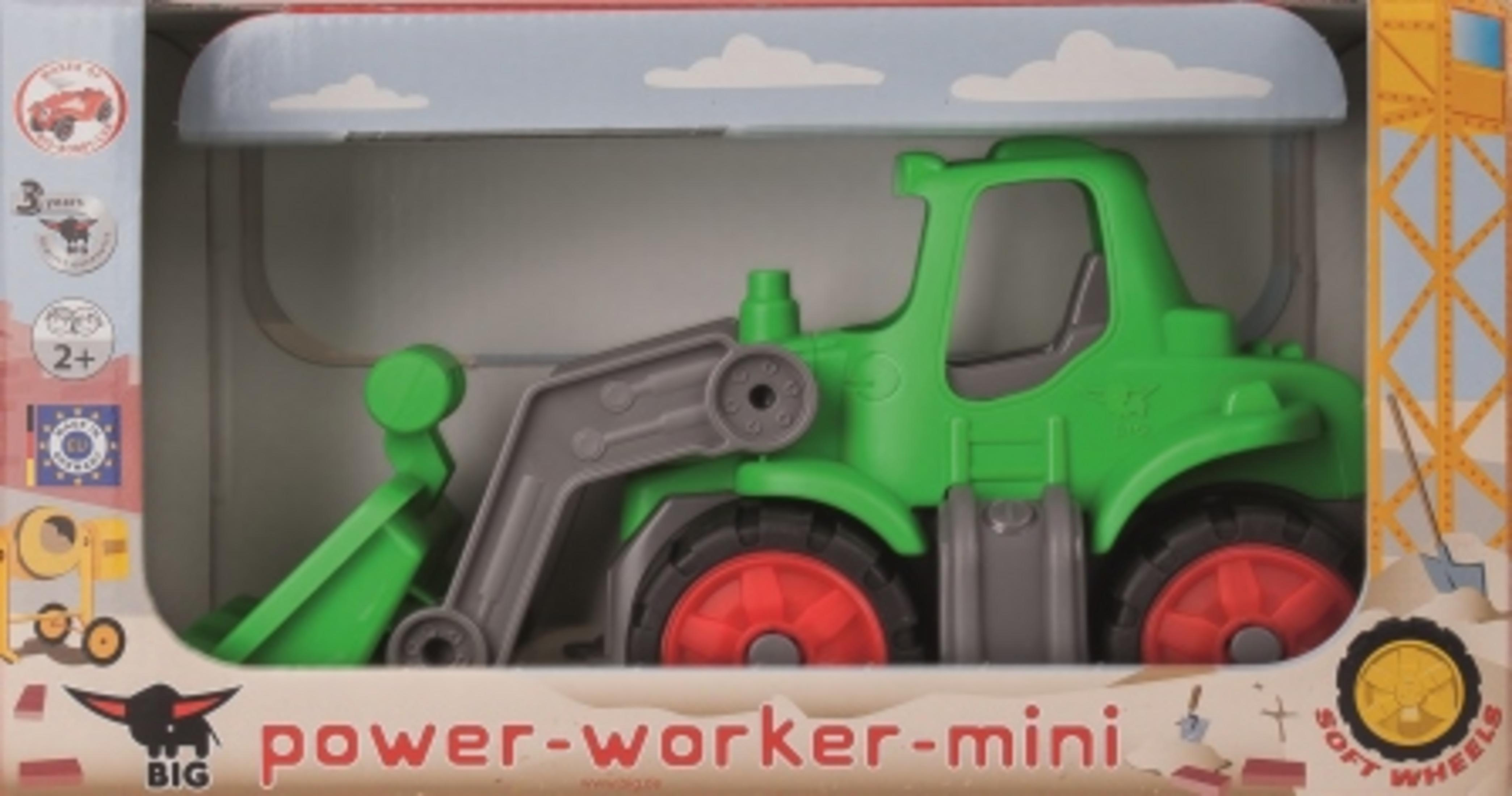 Zielony traktor zabawka znajduje się w pudełku z tekstem i logo.