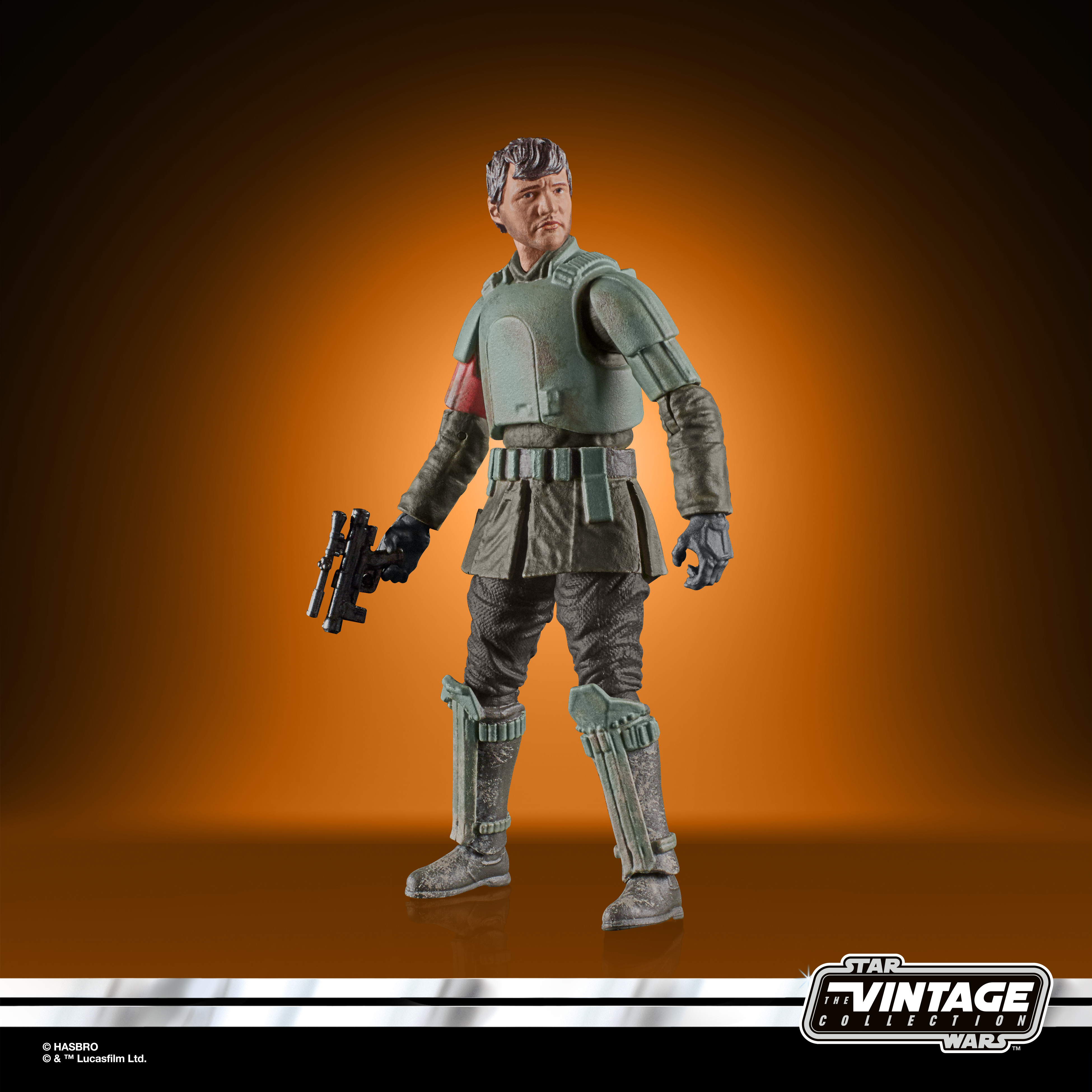 Una figura di Star Wars con una pistola. Indossa un'uniforme verde ed è in una scatola vintage.