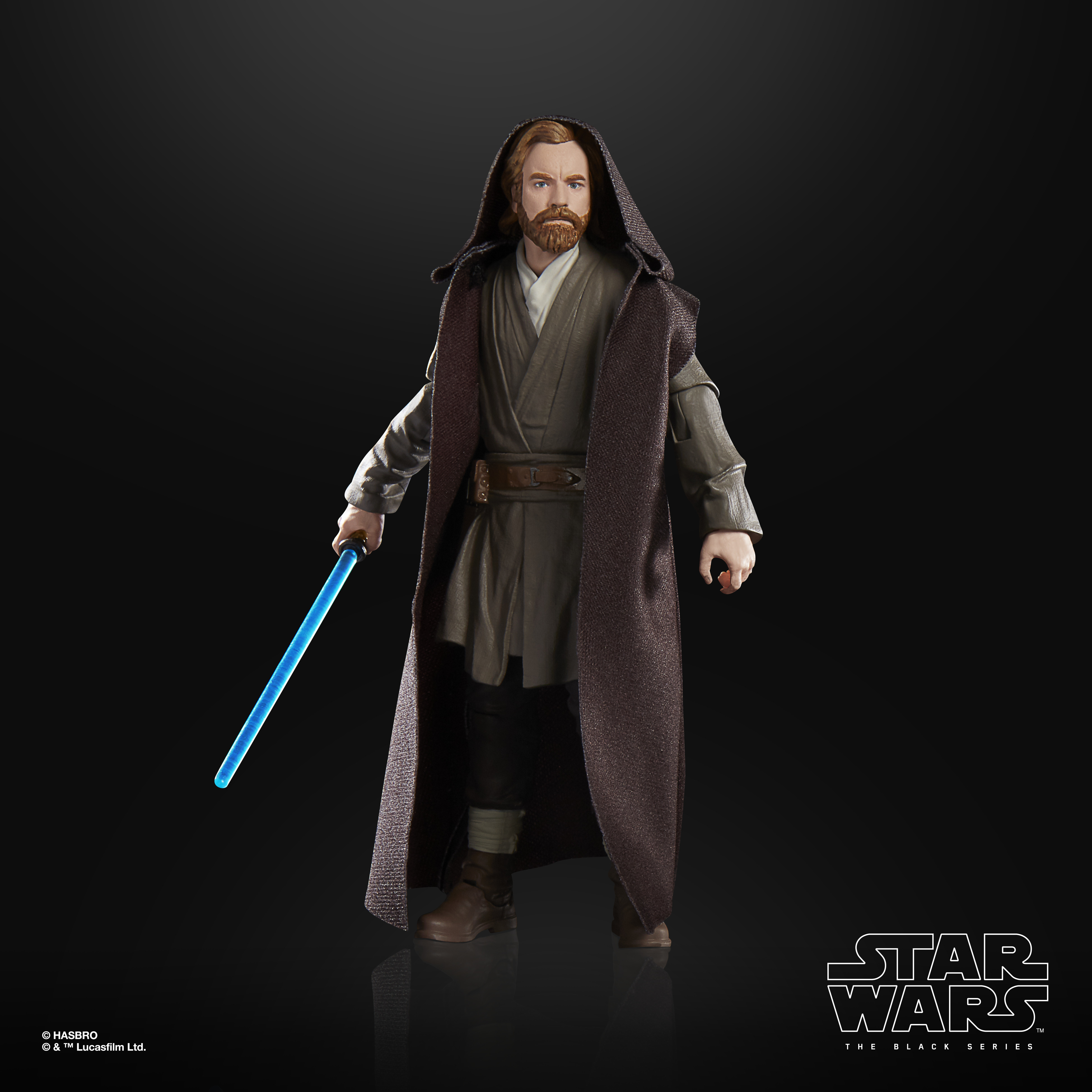 Action figure di Star Wars, Obi-Wan Kenobi in abiti marroni, con una spada laser blu. Sfondo nero con logo Star Wars.