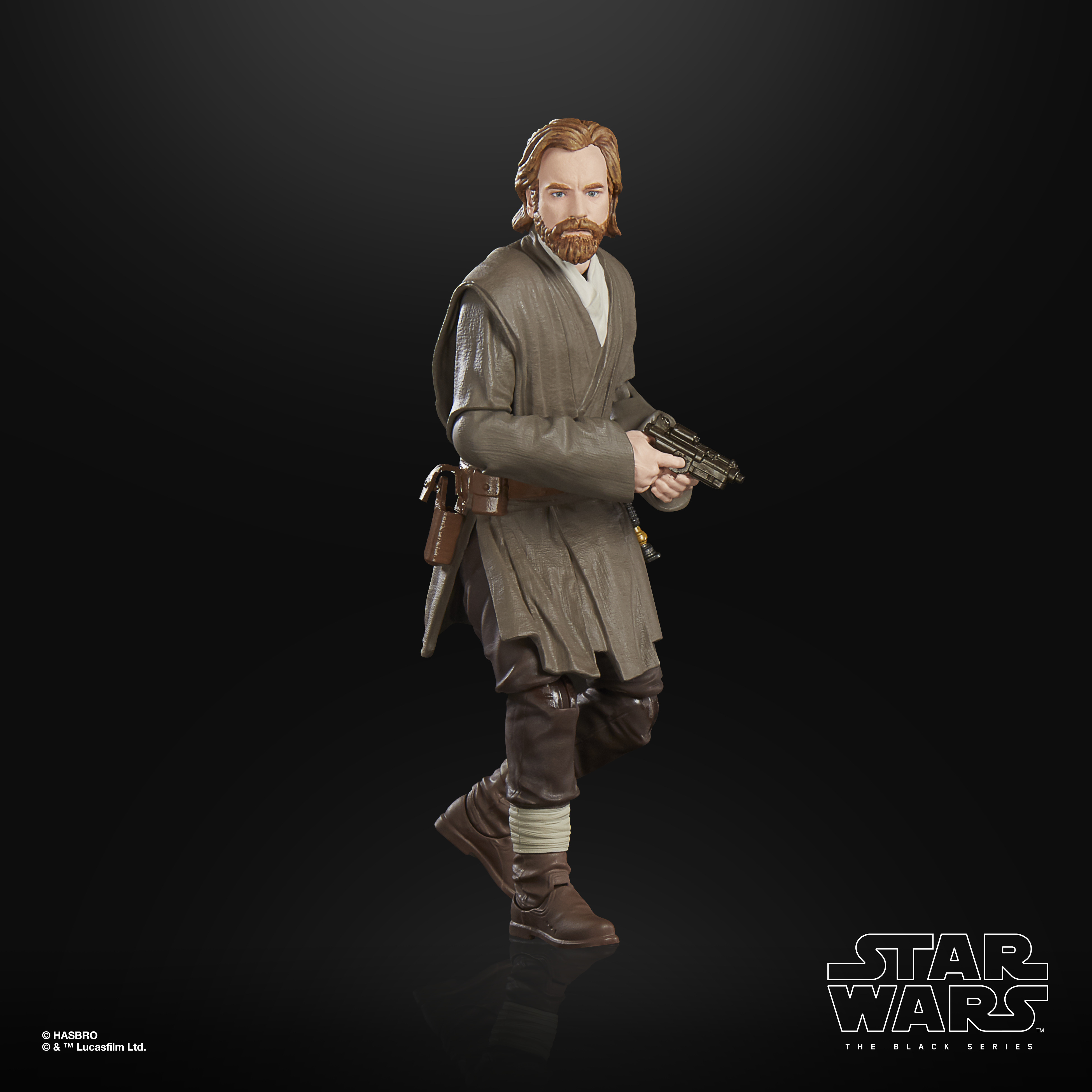 Una figura di Star Wars di un uomo in abiti marroni con una pistola e una cintura con una tasca. Sfondo nero.