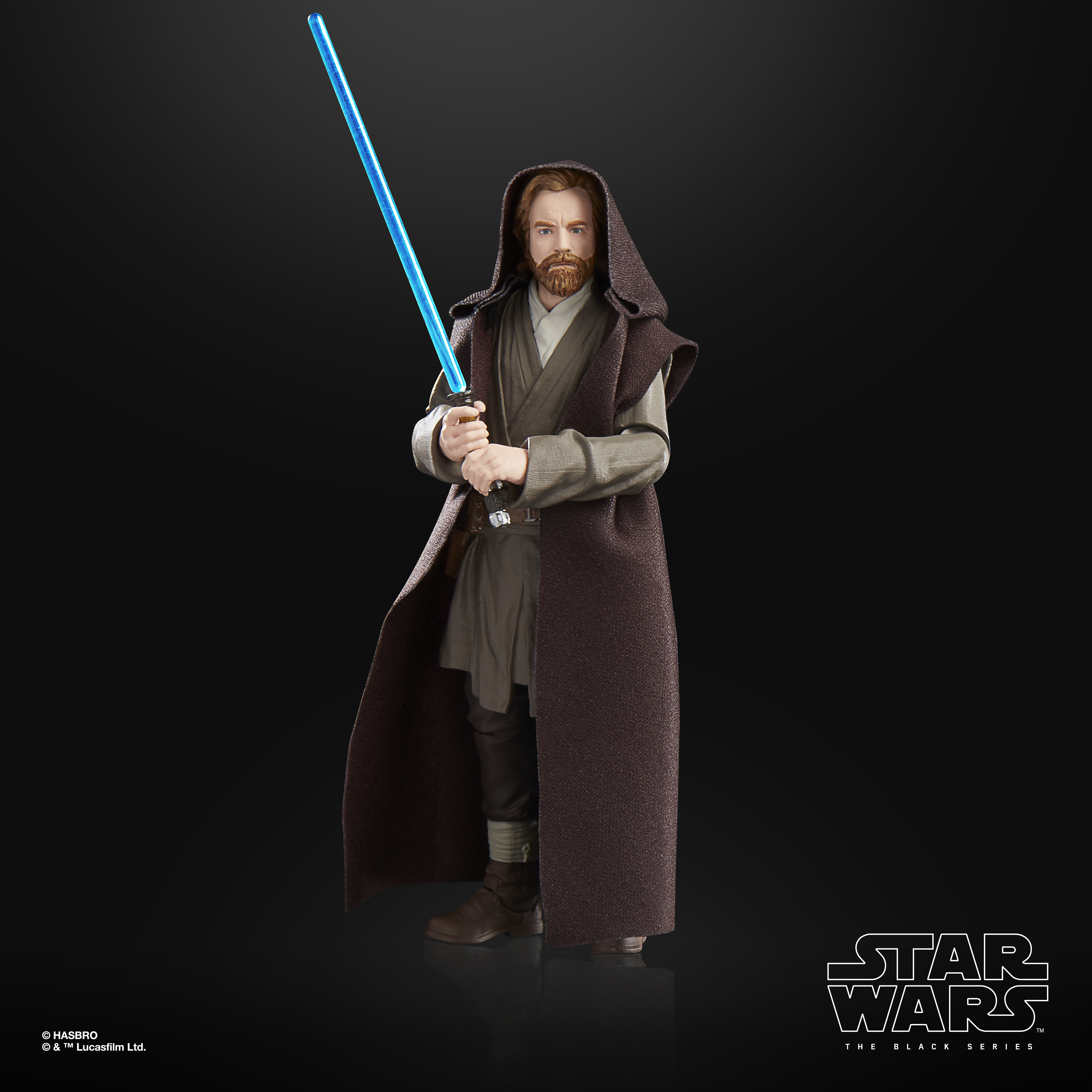 Figura di Star Wars Obi-Wan Kenobi in tunica marrone, con spada laser blu. Sfondo nero.