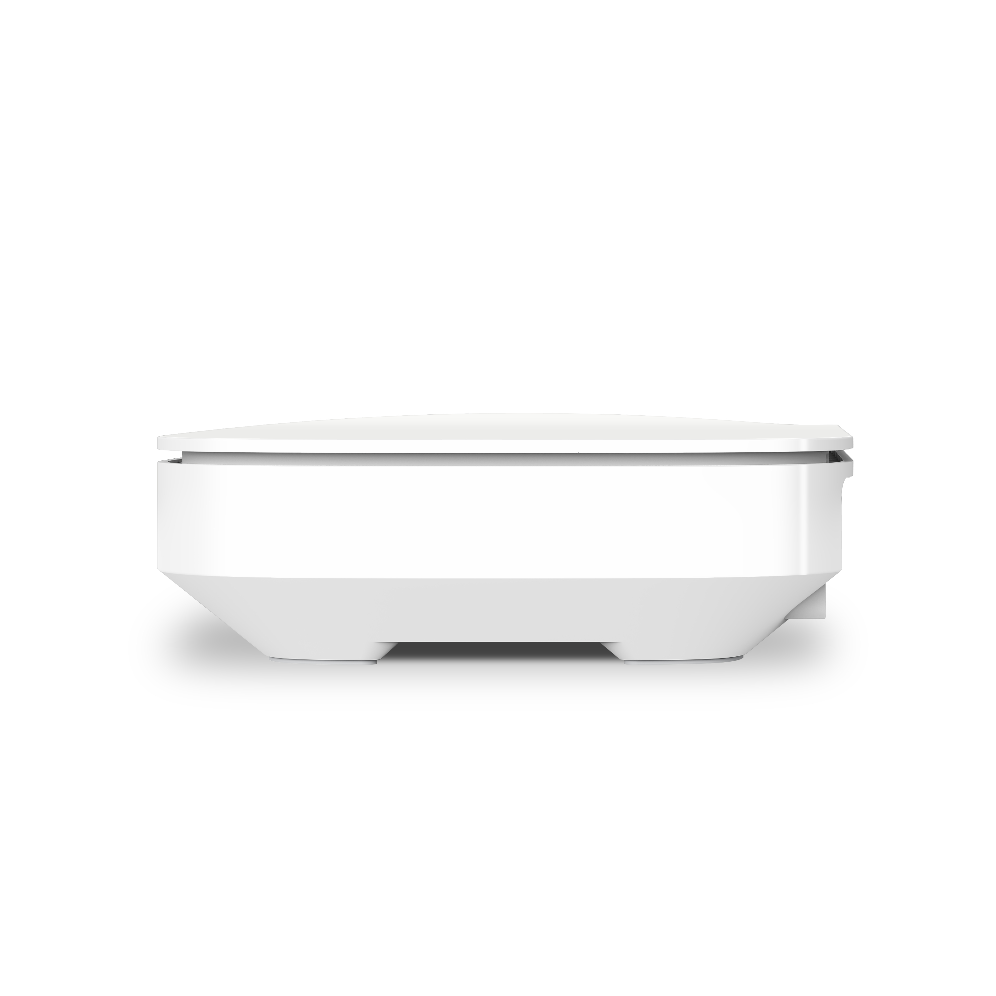 Dispositivo blanco con parte superior plana y lados angulados. Visto de lado.