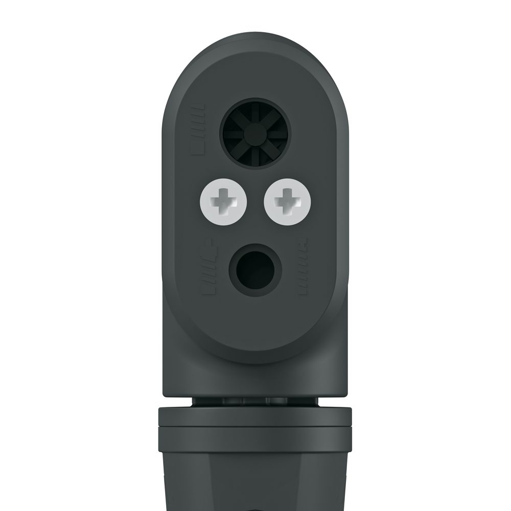 Zbliżenie ciemnoszarego elementu z tworzywa sztucznego ze śrubami i otworami wentylacyjnymi.