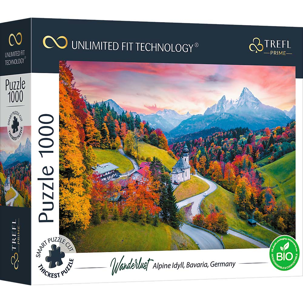 Boîte de puzzle avec une image de paysage d'une vallée avec des bâtiments et des montagnes.