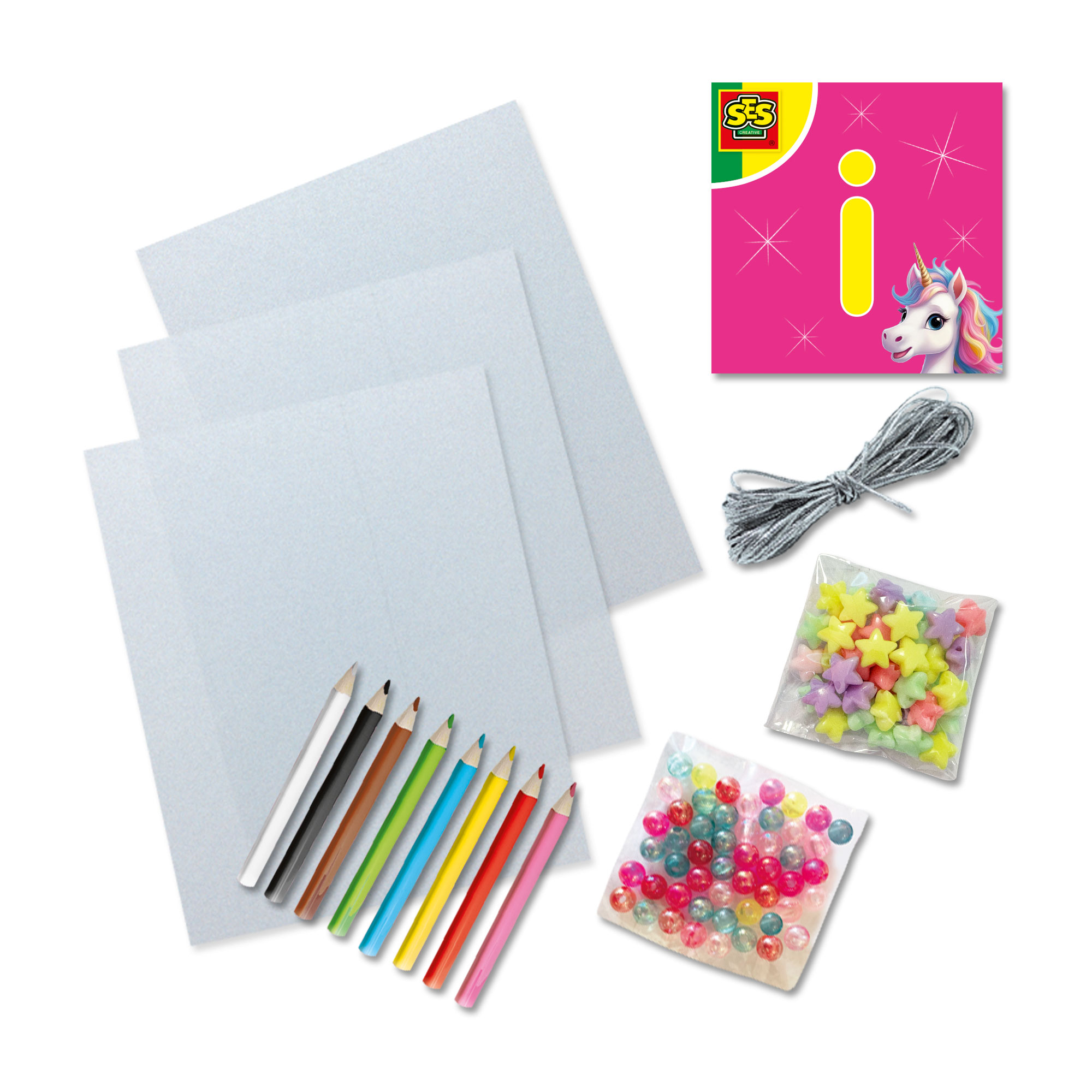 Set di artigianato con matite colorate, carta, perline, filo e un disegno a tema unicorno.