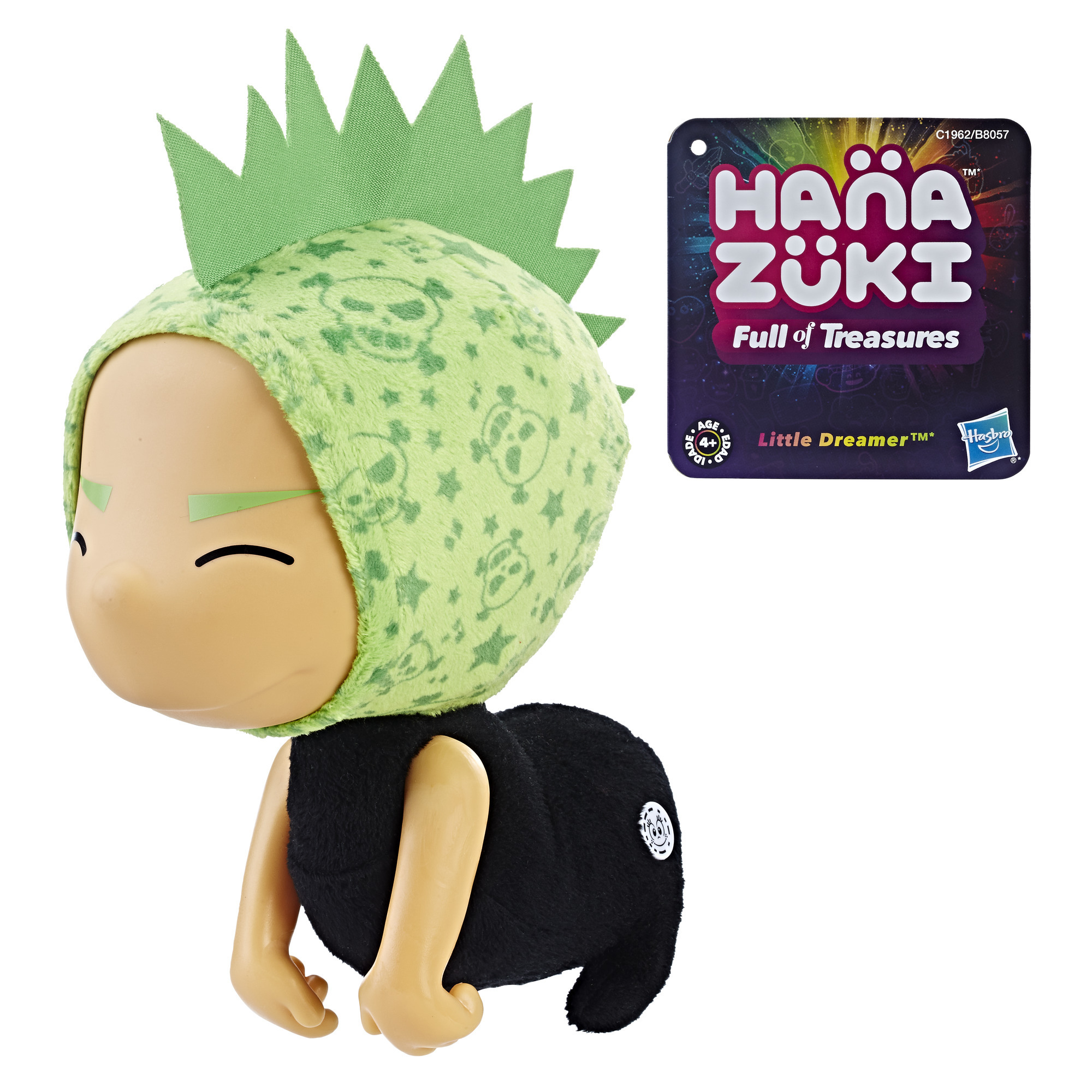 Eine Hana Zuki-Puppe mit grüner Kopfbedeckung und einem Etikett mit der Aufschrift 'Little Dreamer' und 'Full of Treasures'.