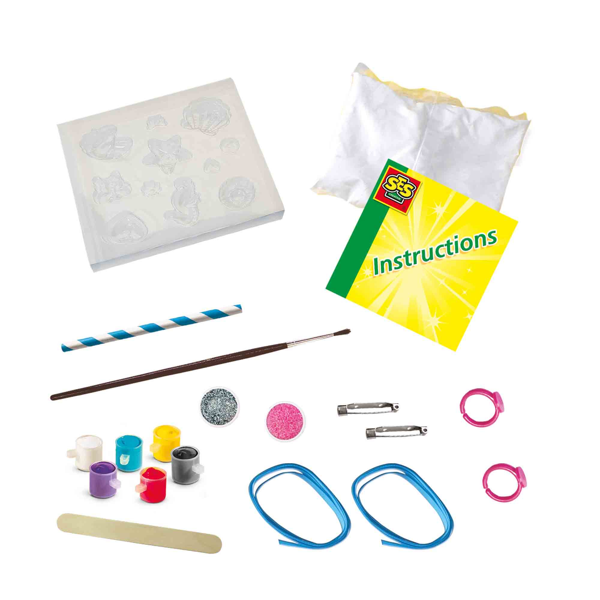 Zestaw rzemieślniczy: formy, farby, brokat, pędzle, instrukcje, szpilki, pierścionki i niebieskie wstążki.