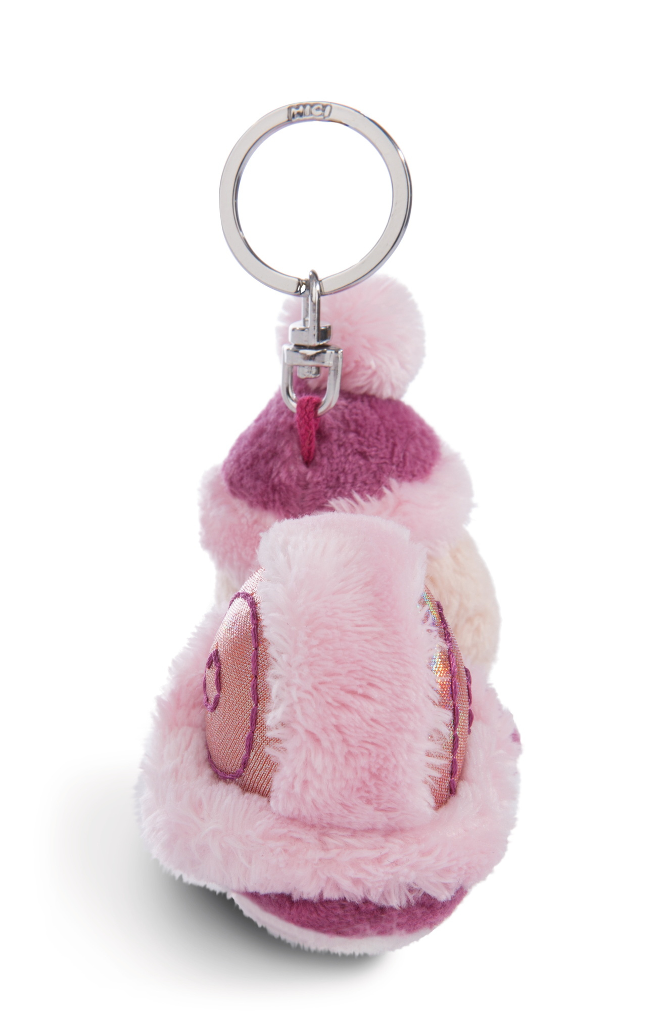 Różowy brelok z pluszową zabawką. Zabawka przypomina postać w kształcie jajka z pomponem.