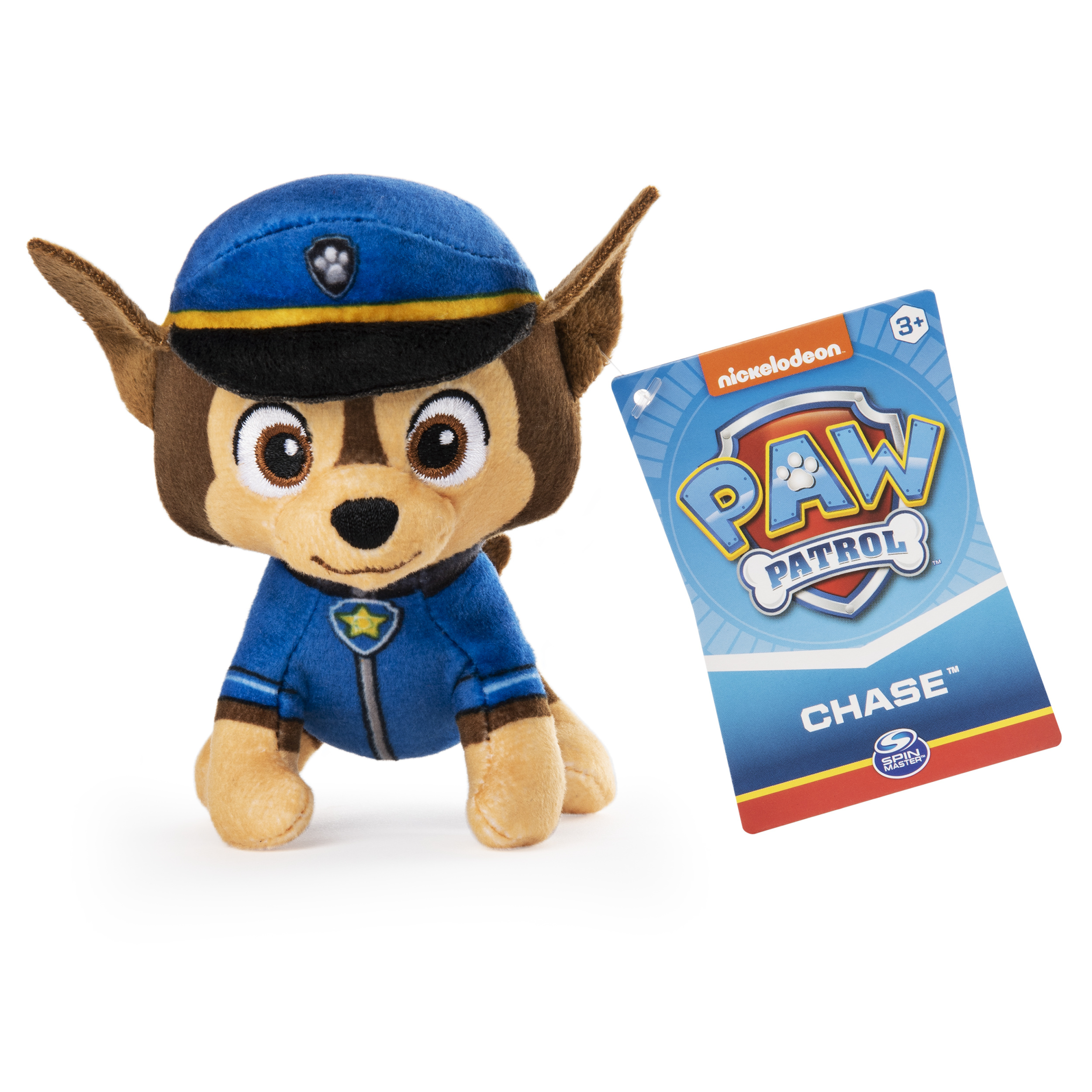 Un peluche de Chase de Paw Patrol, con uniforme y gorra azules. Hay una tarjeta a la derecha.