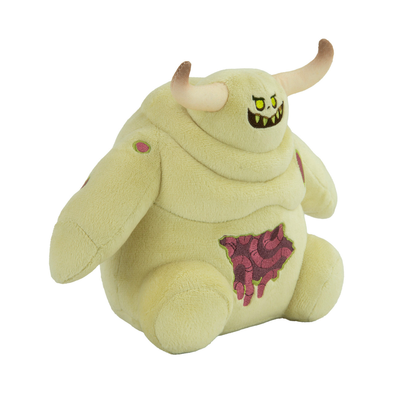 Monstre en peluche jaune avec des cornes et un visage effrayant, montrant une blessure.