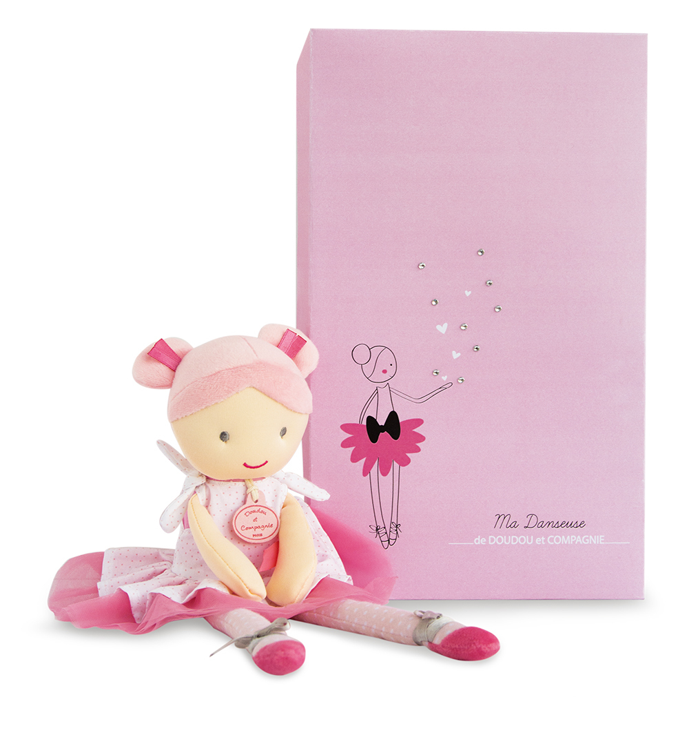 Różowa lalka baletnicy z różowym pudełkiem, pokazująca ilustrację baletnicy.