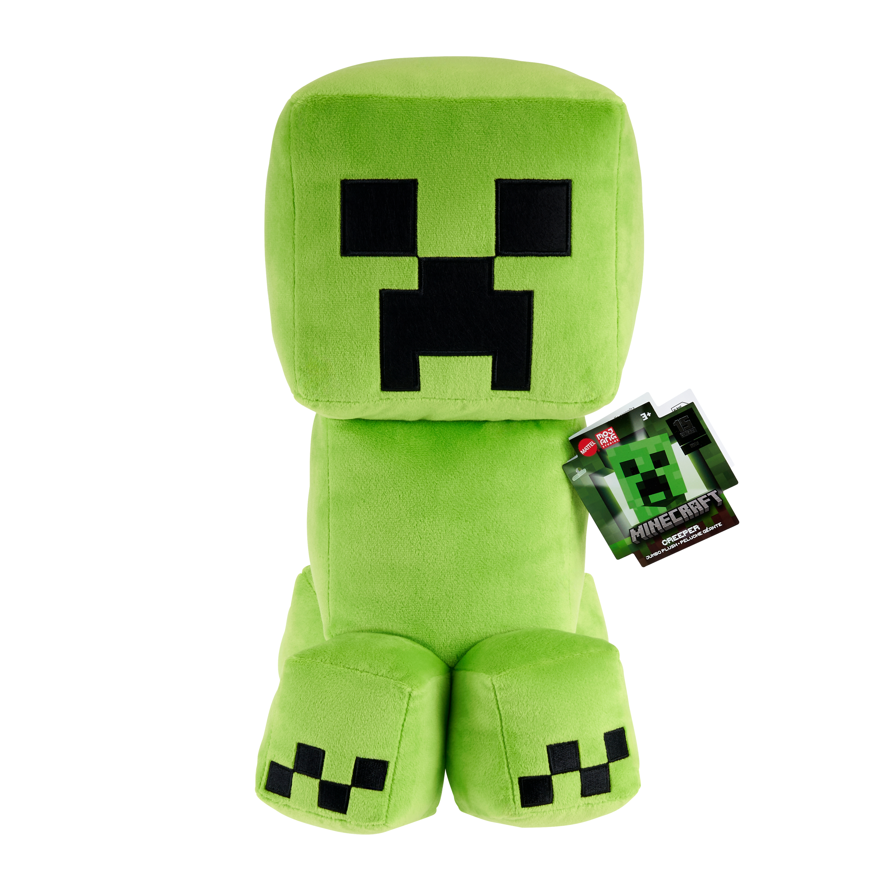 Peluche verde Creeper di Minecraft, occhi e bocca quadrati neri, etichetta, sfondo bianco.