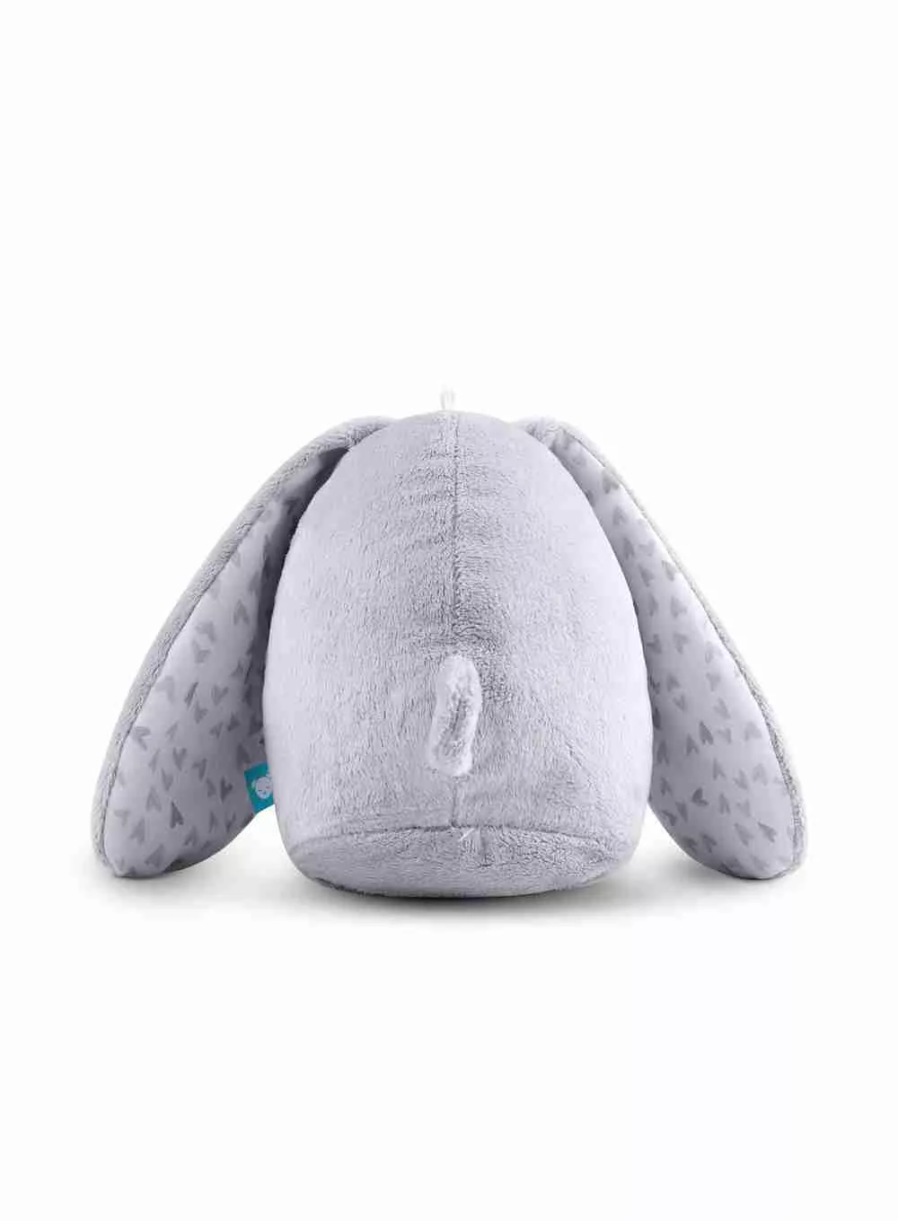 Un coniglietto di peluche grigio da dietro, con le orecchie alzate. Le orecchie hanno motivi a cuore.