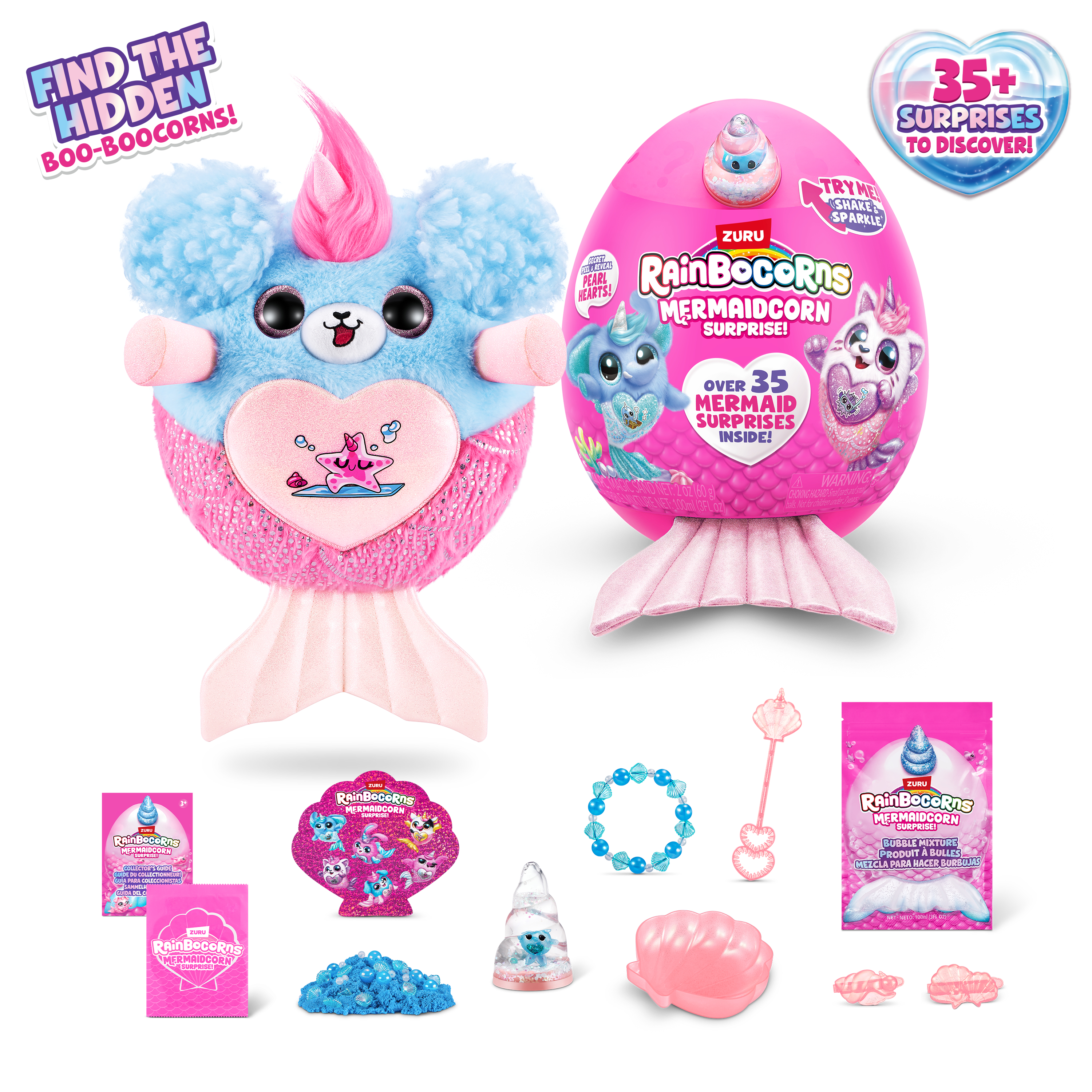 Dwa Rainbocorns, jeden otwarty, z akcesoriami. Jeden to pluszowy jednorożec z ogonem syreny.