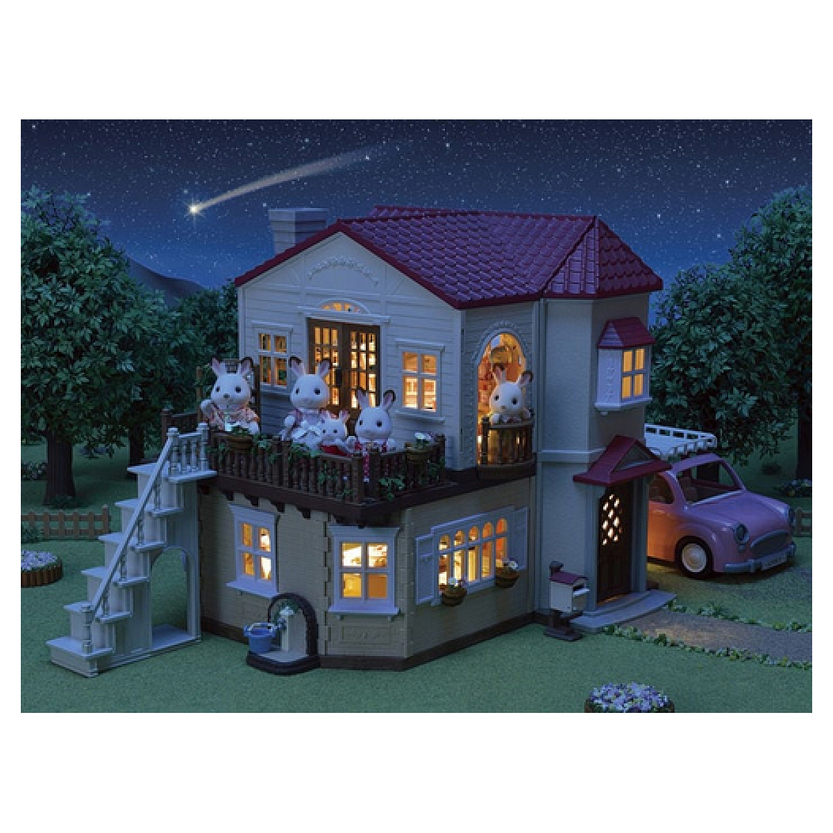 Casa de juguete con conejos en el balcón, un coche rosa y cielo nocturno estrellado.