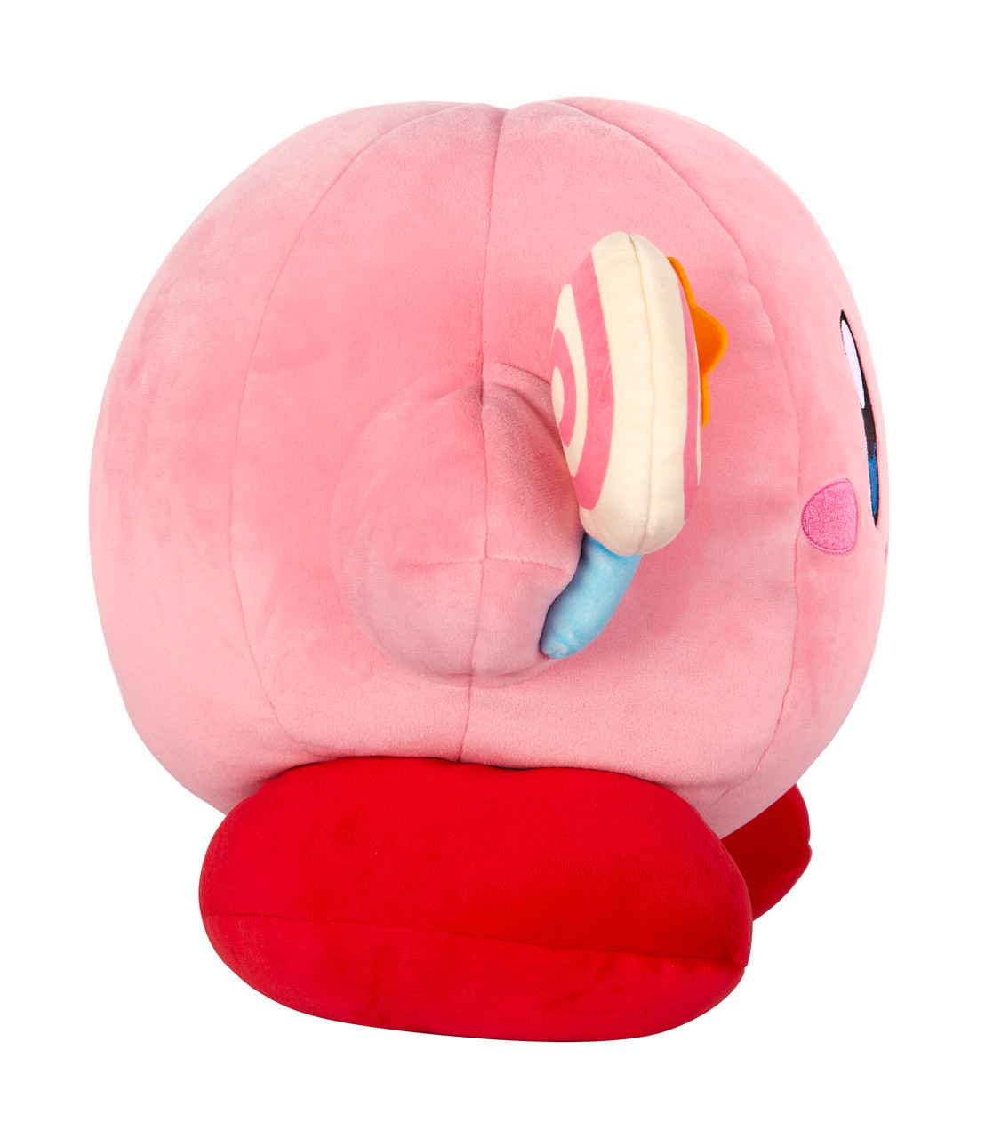 Un peluche rosa di Kirby che tiene un lecca-lecca su sfondo bianco. Vista laterale del personaggio.