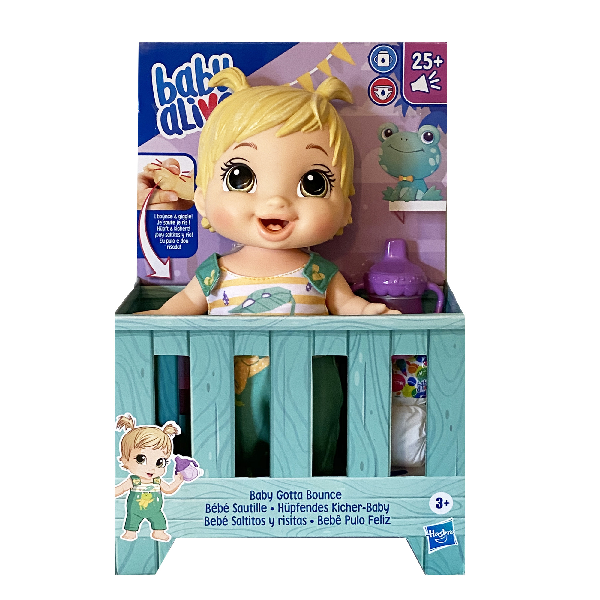 Lalka Baby Alive w kołysce. Lalka ma blond włosy. Pudełko jest niebiesko-białe.