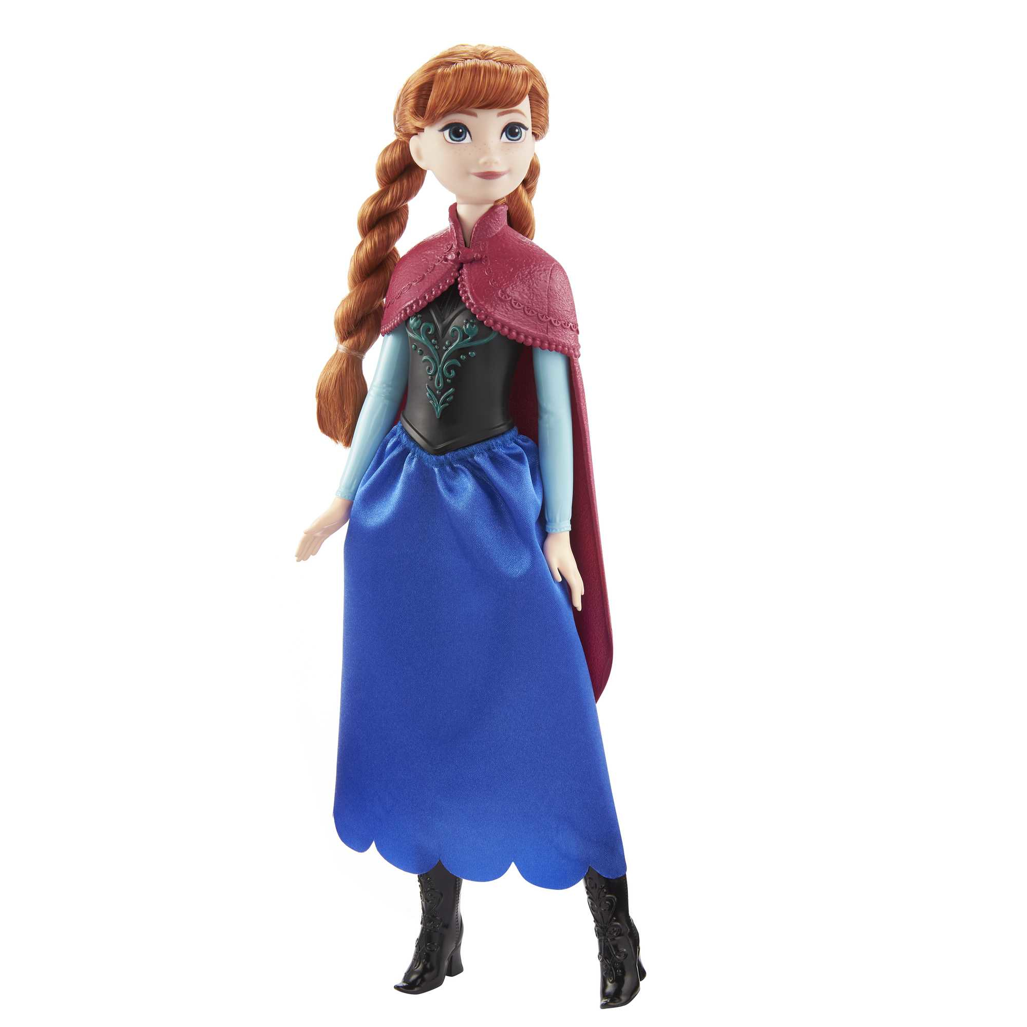 Anna-Puppe aus Frozen. Sie hat geflochtenes rotes Haar, einen Umhang, ein schwarzes Oberteil und einen blauen Rock. Sie steht.