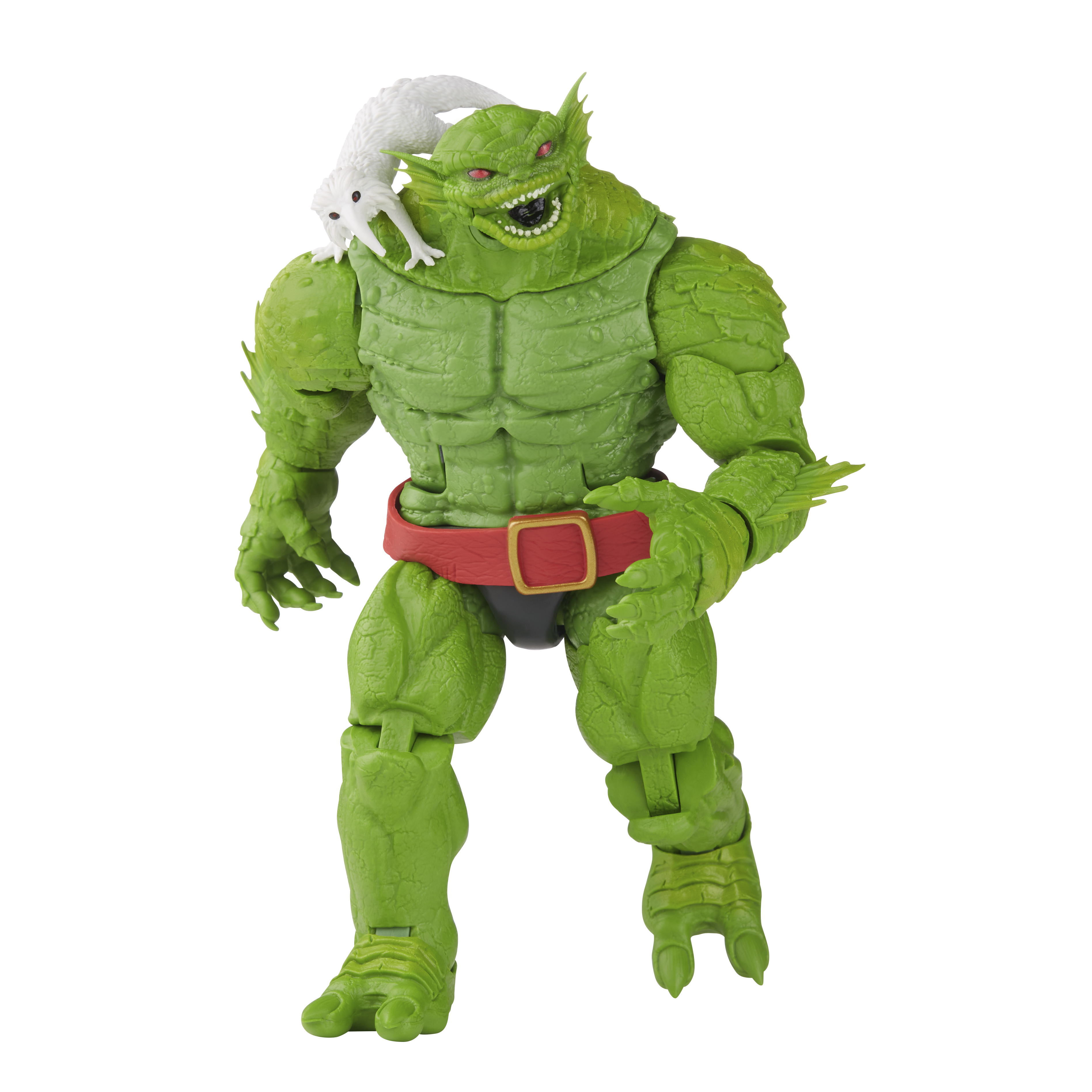 Zielona figurka potwora z białym stworzeniem na ramieniu, czerwony pas, białe tło.