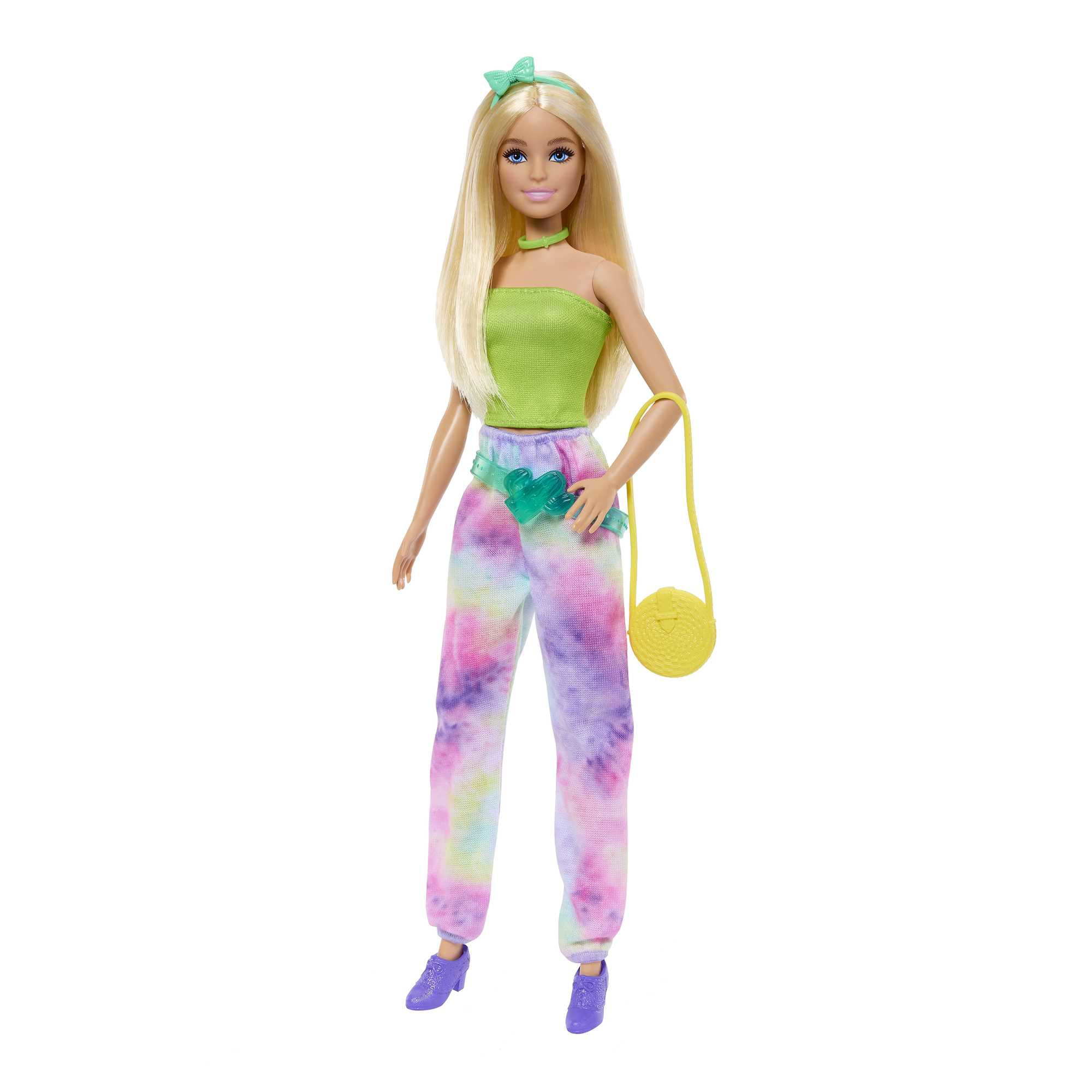 Blonde Barbie-Puppe in grünem Oberteil, Batik-Hose und gelber Handtasche.