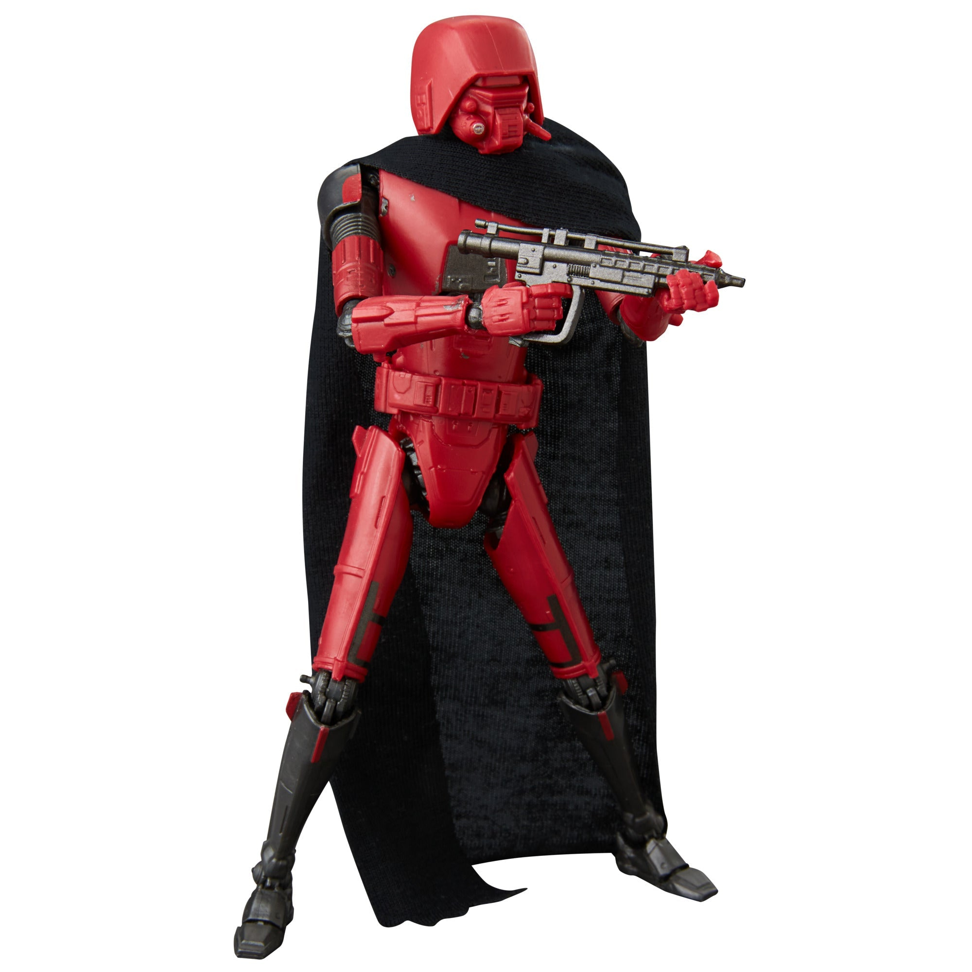 Rote Actionfigur mit schwarzem Umhang und Pistole, posierend mit futuristischem Aussehen, nach rechts gerichtet.