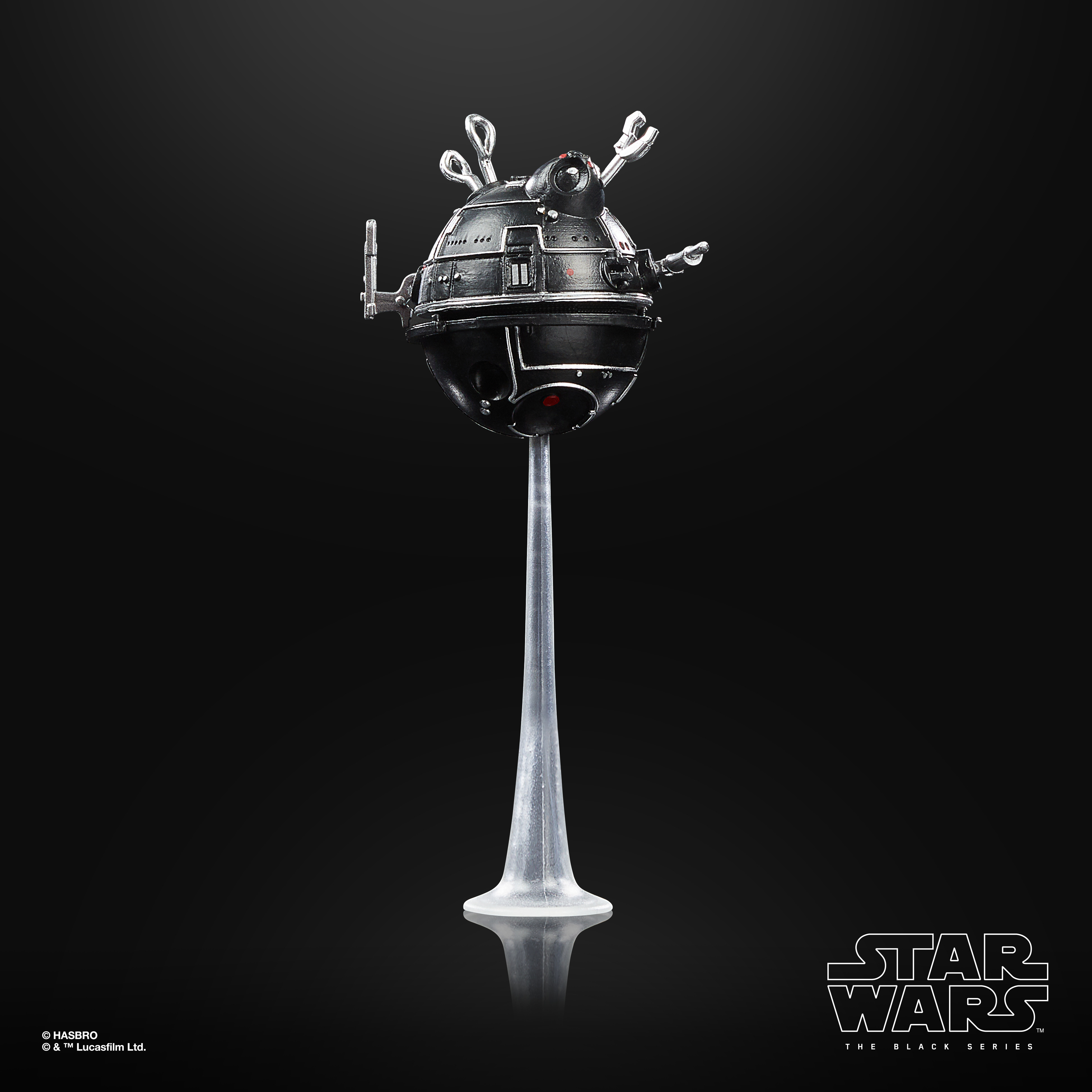 Un droide nero su un supporto, da Star Wars. Lo sfondo è nero.