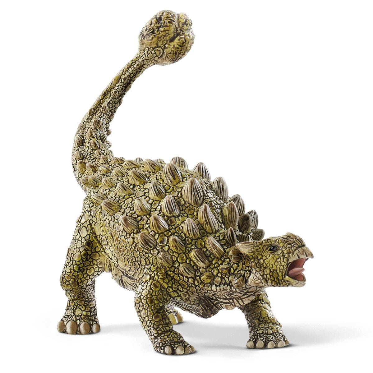 Un giocattolo di dinosauro con corpo spinoso, in piedi su una superficie bianca, con la bocca aperta.