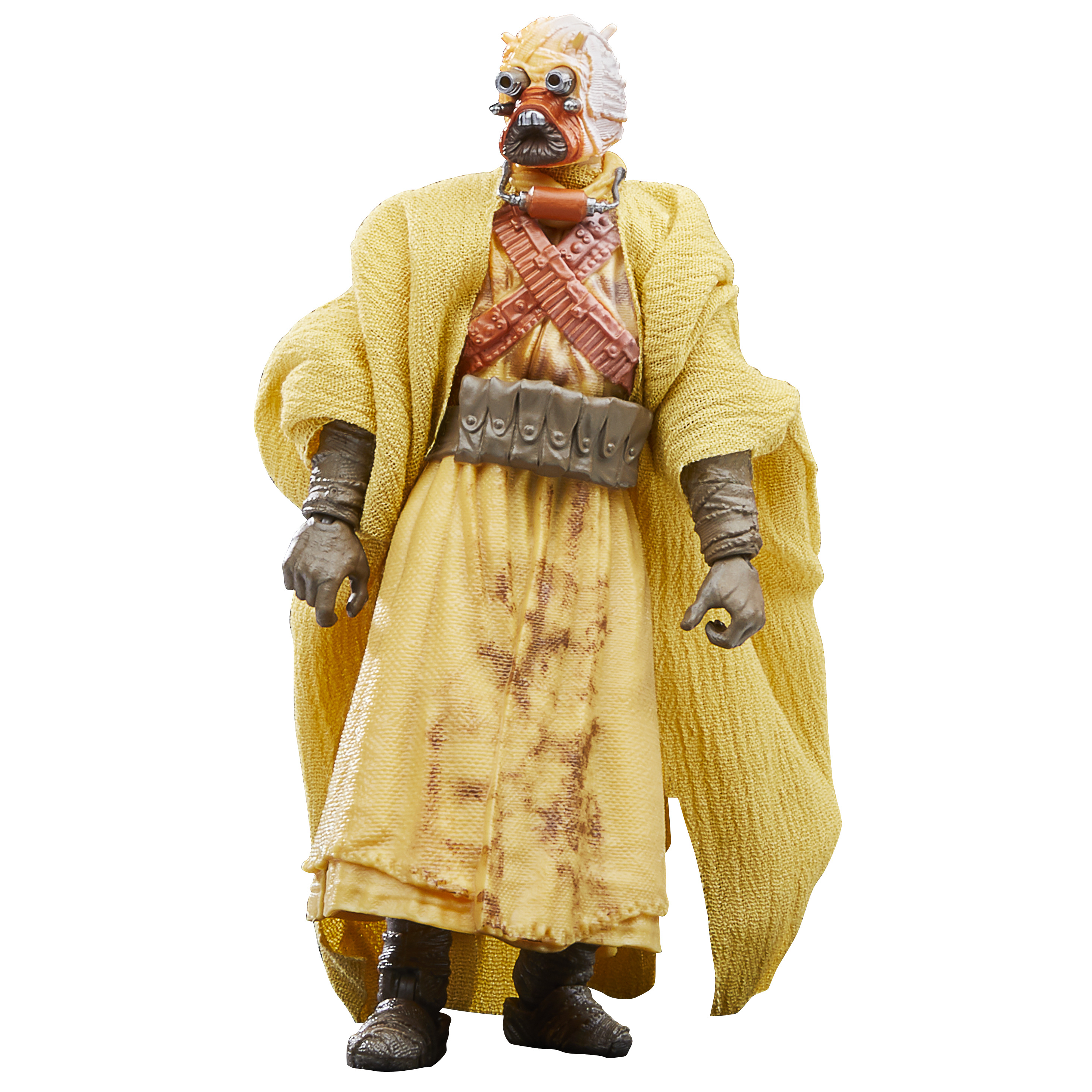 Una figura di Star Wars. È un Tusken Raider, che indossa una veste gialla e una maschera. Ha una bandoliera.