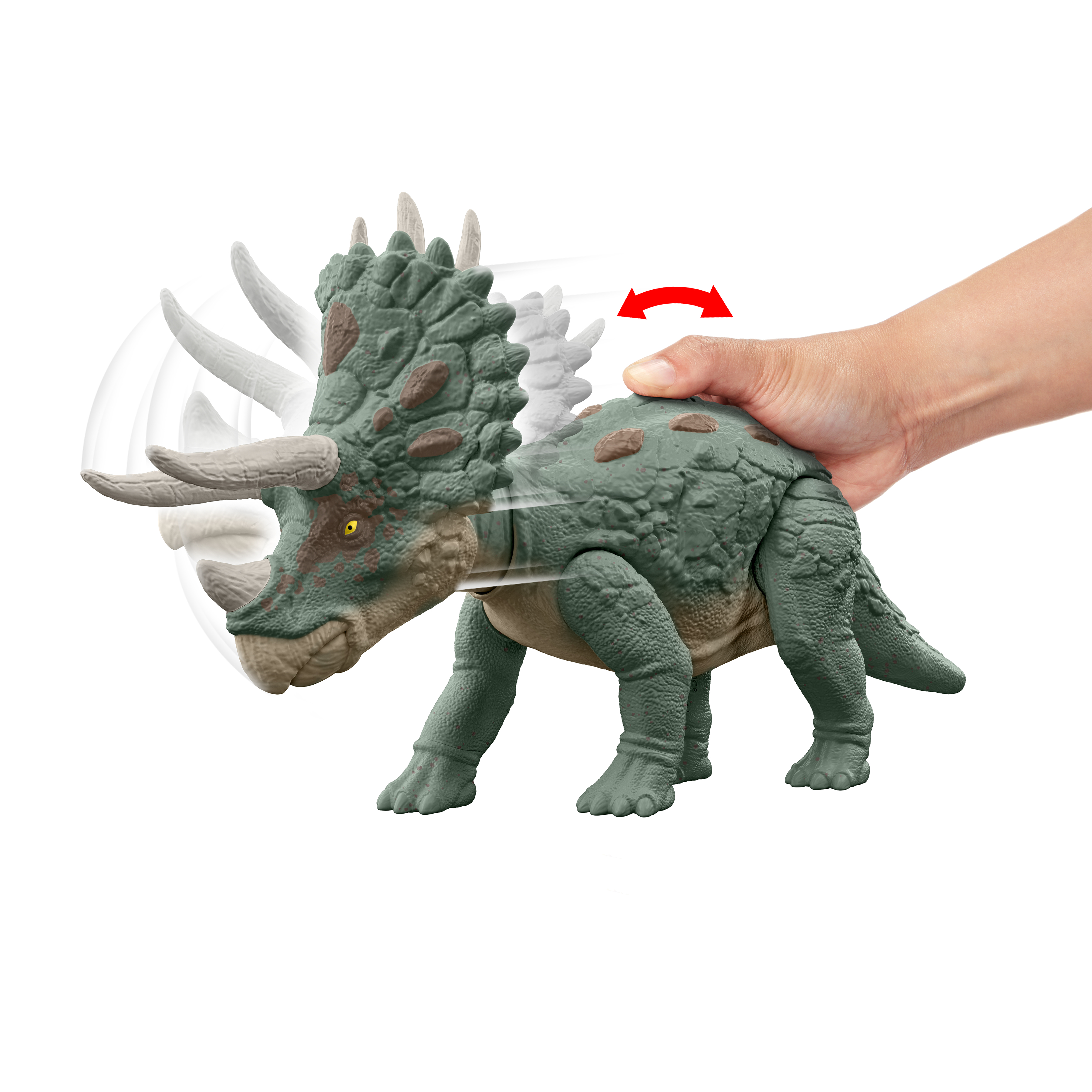Una mano gira la cabeza de un juguete Triceratops. El juguete es verde y marrón con cuernos y un volante.