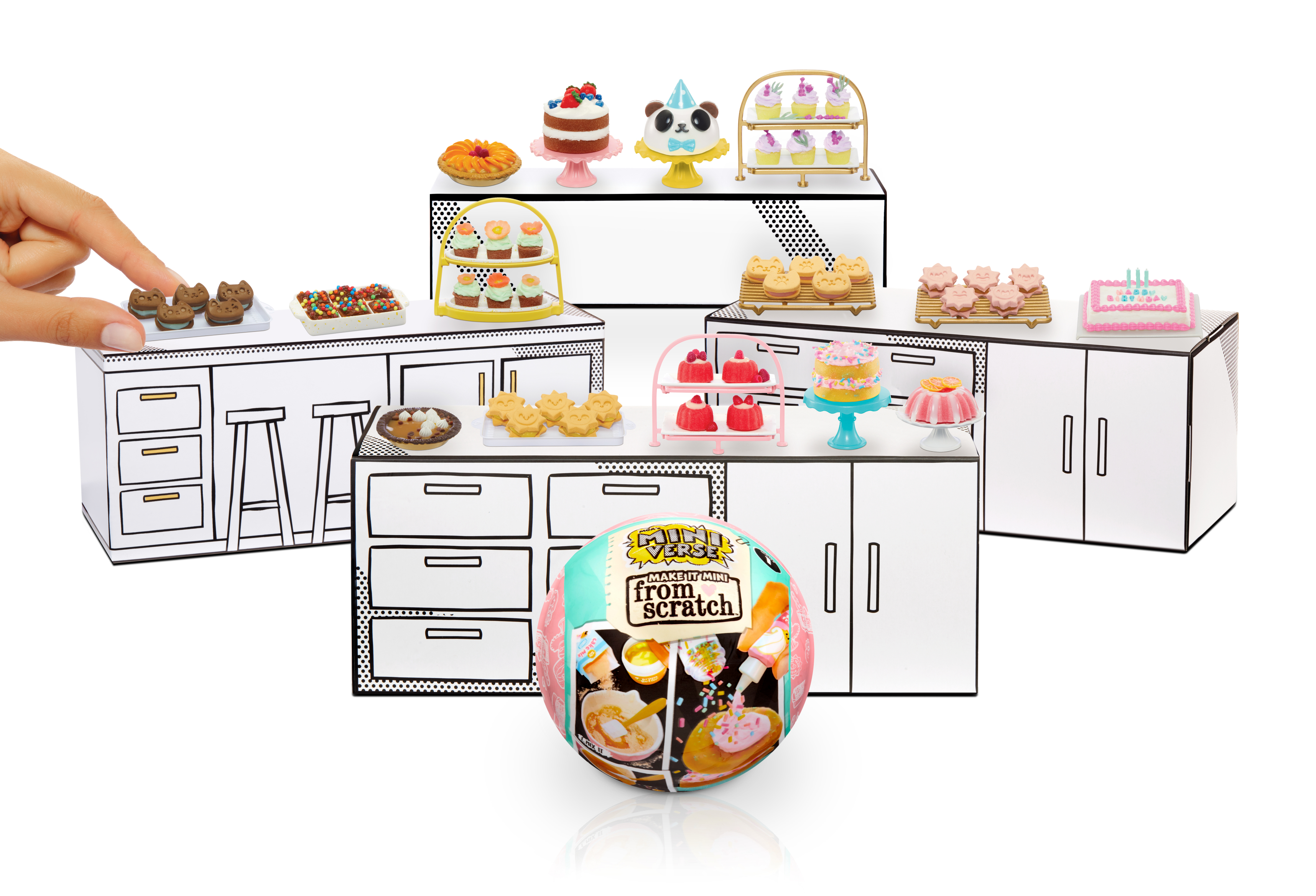 Zestaw zabawek kuchennych z różnymi deserami na wystawie.