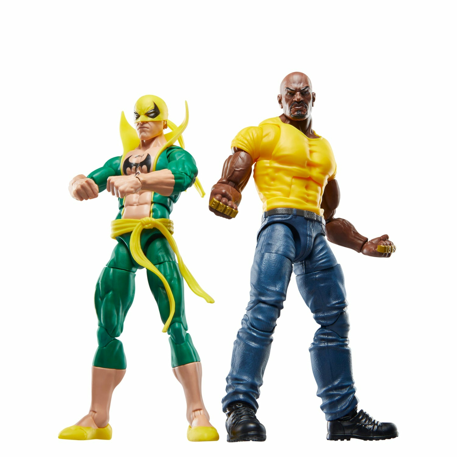 Dwie figurki: Iron Fist w zieleni i Luke Cage w żółci, obaj w dynamicznych pozach na białym tle.