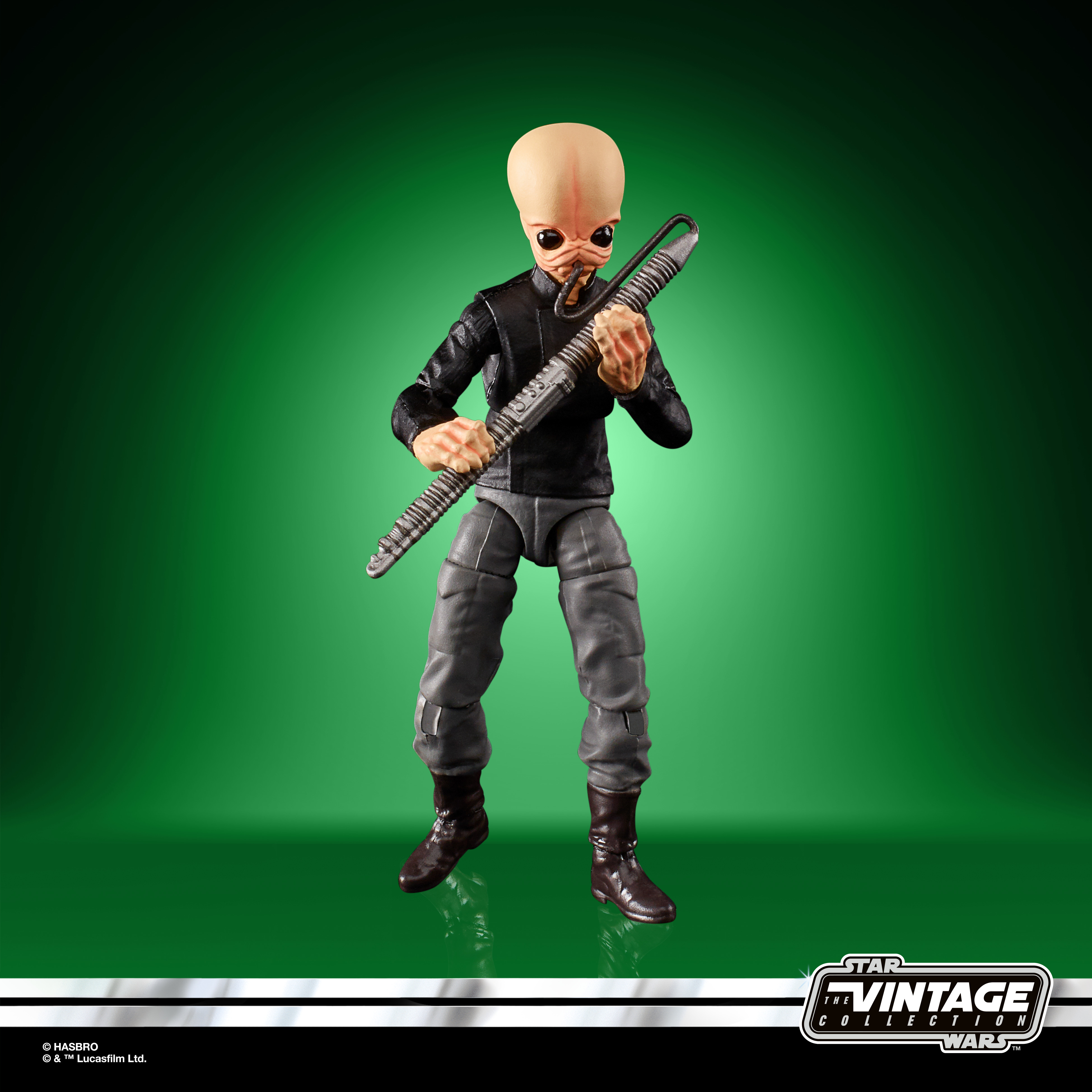 Eine Star Wars-Figur, die ein Musikinstrument hält. Die Figur ist ein kahler Außerirdischer in schwarzem Outfit.