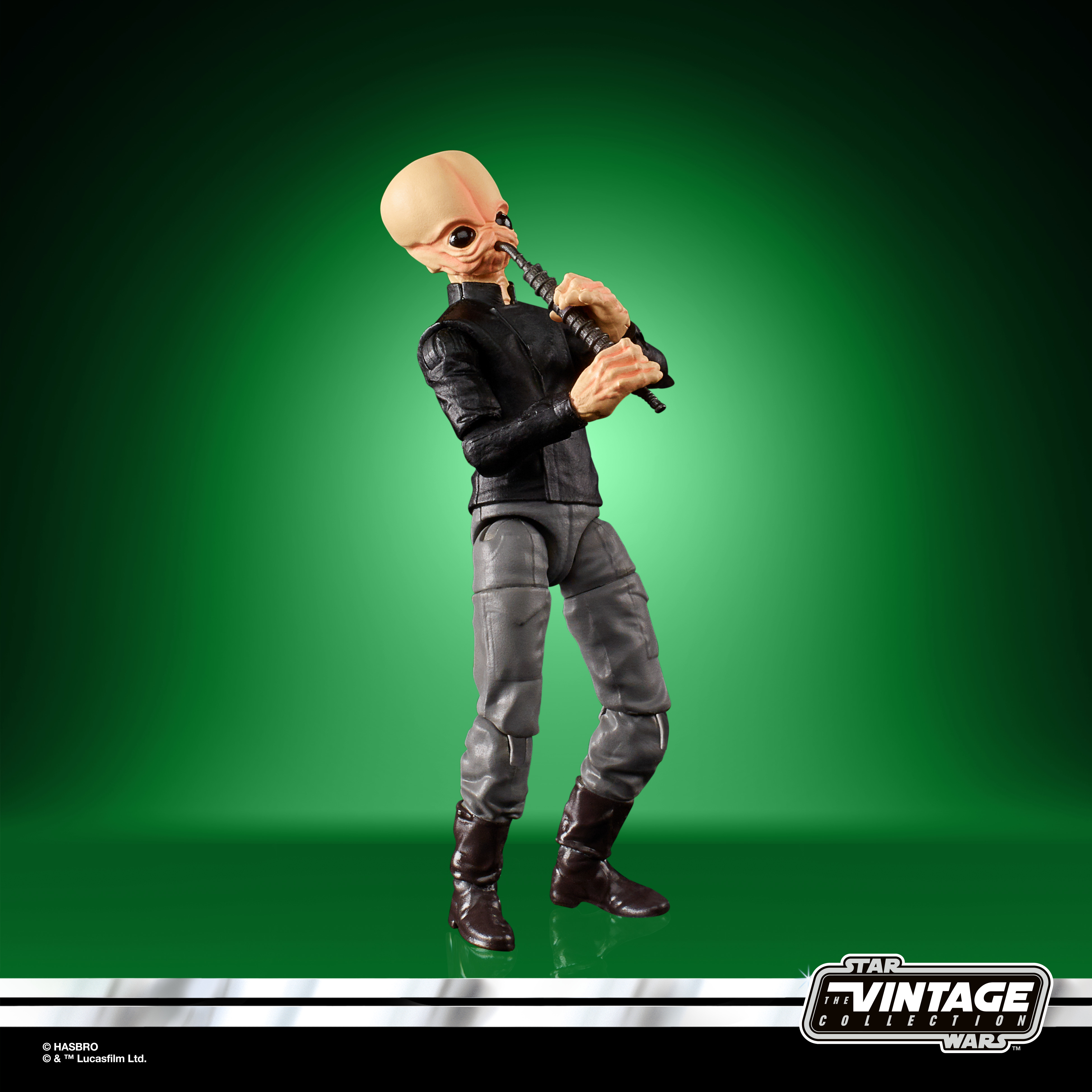 Eine Star Wars-Figur eines kahlen Außerirdischen mit schwarzem Outfit, der ein Musikinstrument hält.