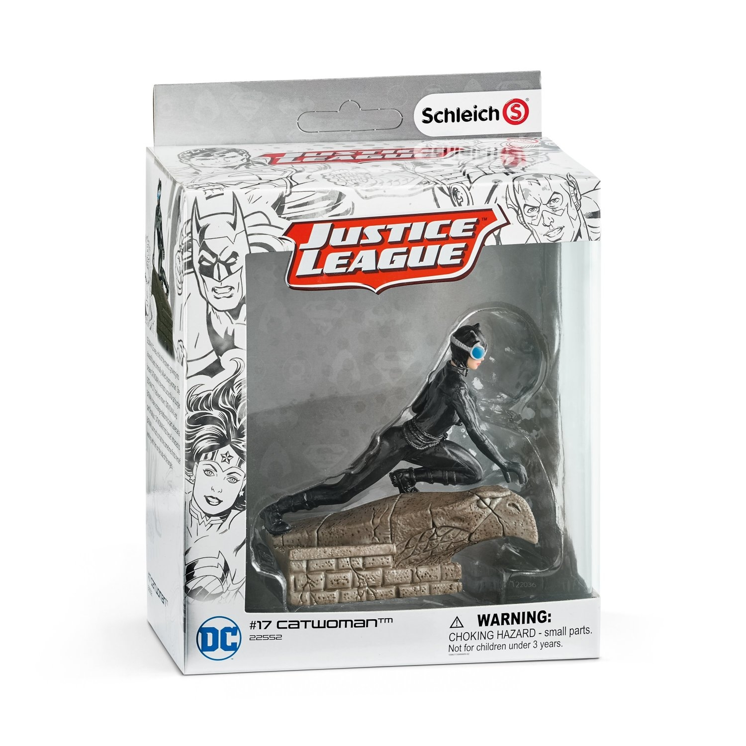 Action figure di Catwoman in una scatola, appoggiata a una roccia, con il marchio Justice League e DC Comics.