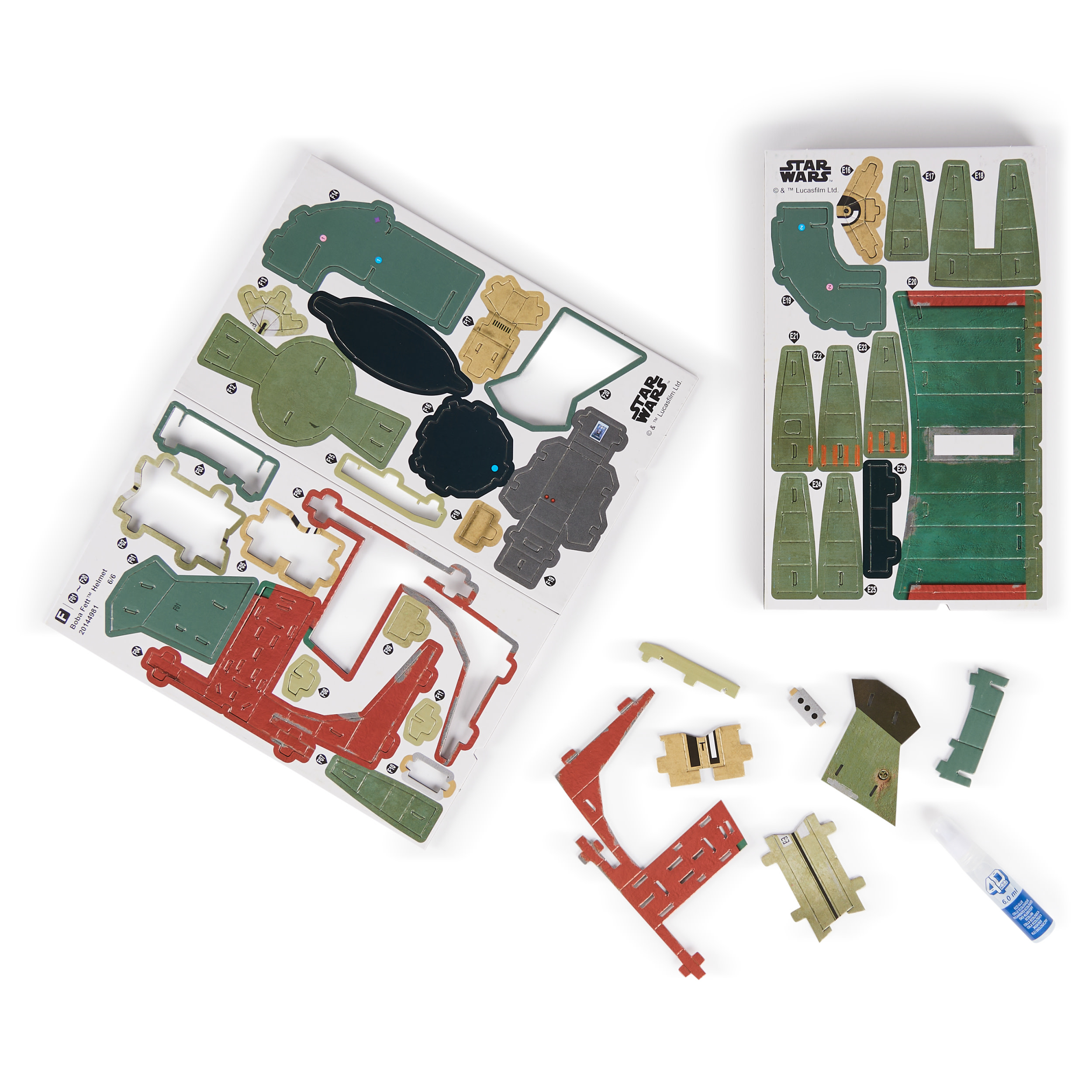 Elementy zestawu modelu Star Wars Boba Fett. Pokazano elementy kartonowe, klej i instrukcje.