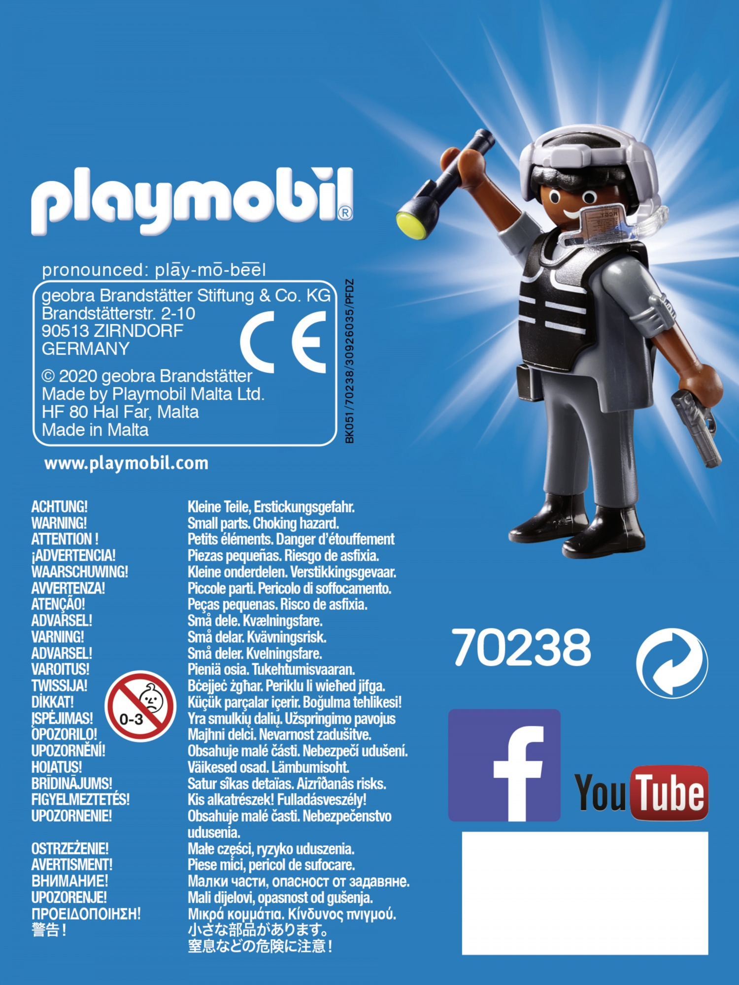 Retro di una scatola Playmobil con un personaggio in tuta spaziale, testi di avvertimento multilingue.
