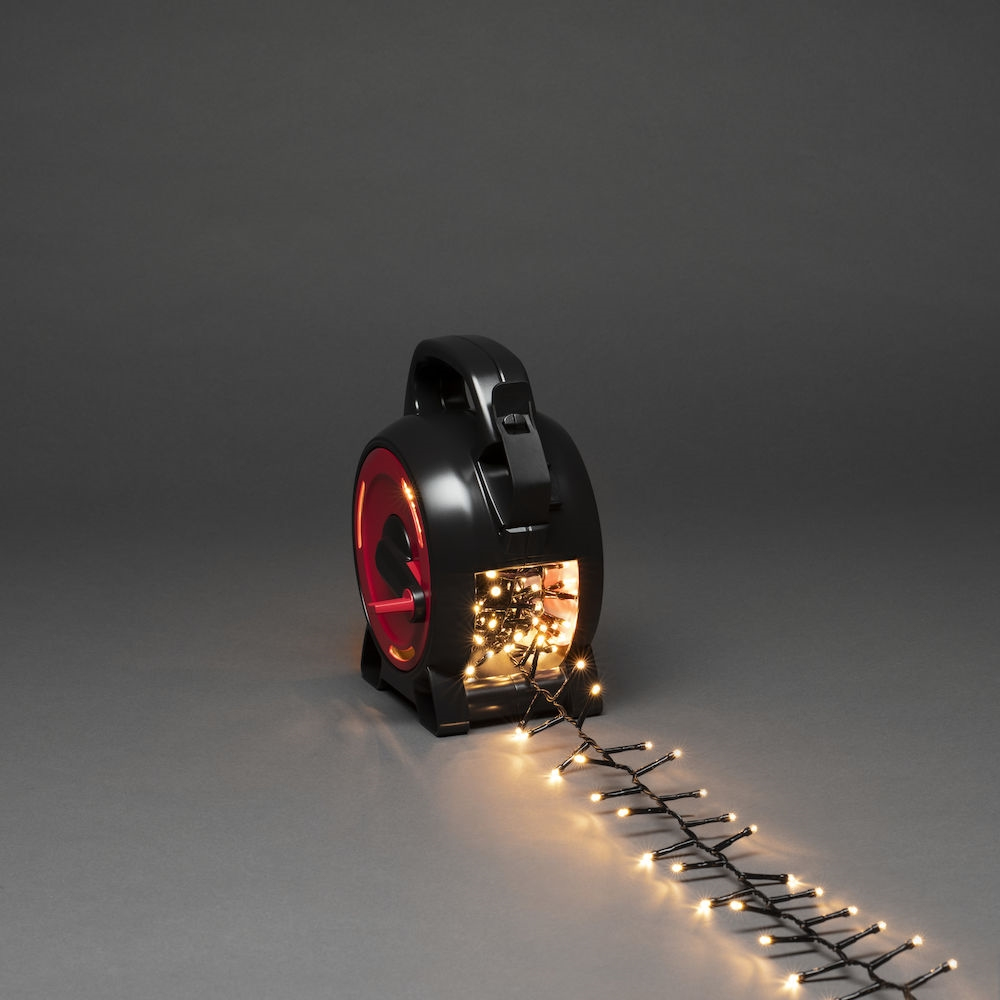 Un avvolgicavo nero e rosso con luci che escono.