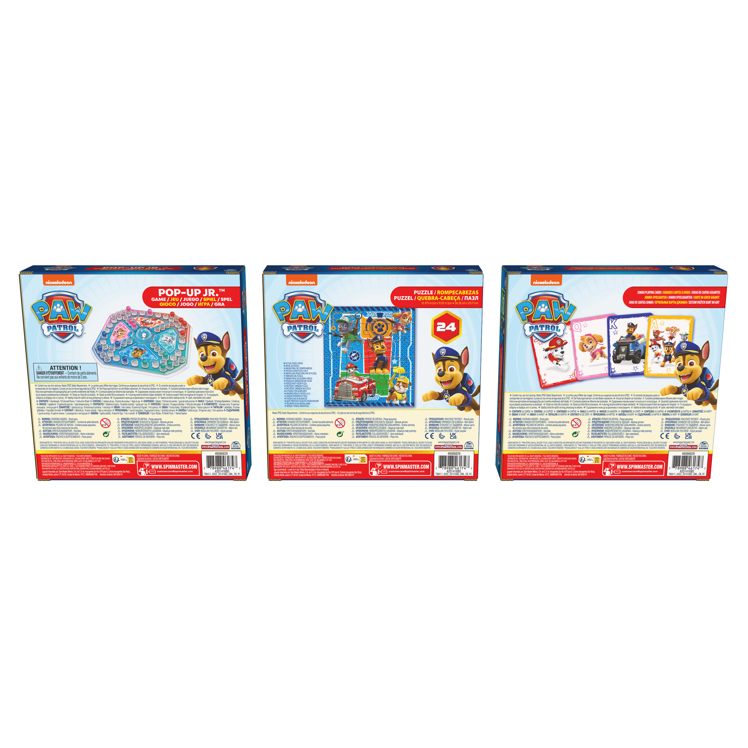 Drie Paw Patrol-dozen met verschillende puzzel- en spelthema's staan naast elkaar.
