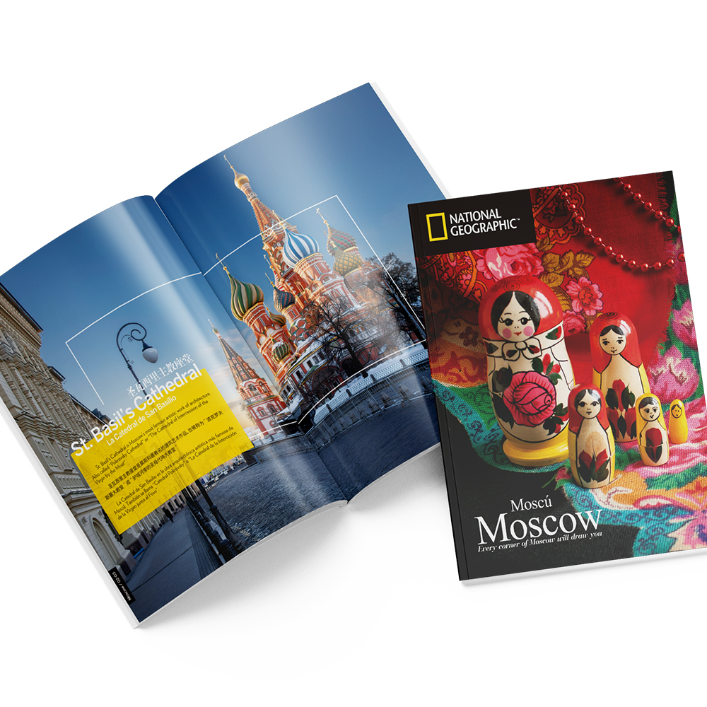 A National Geographic book open to a St. Basil's Cathedral image, with a matching cover featuring matryoshka dolls.
