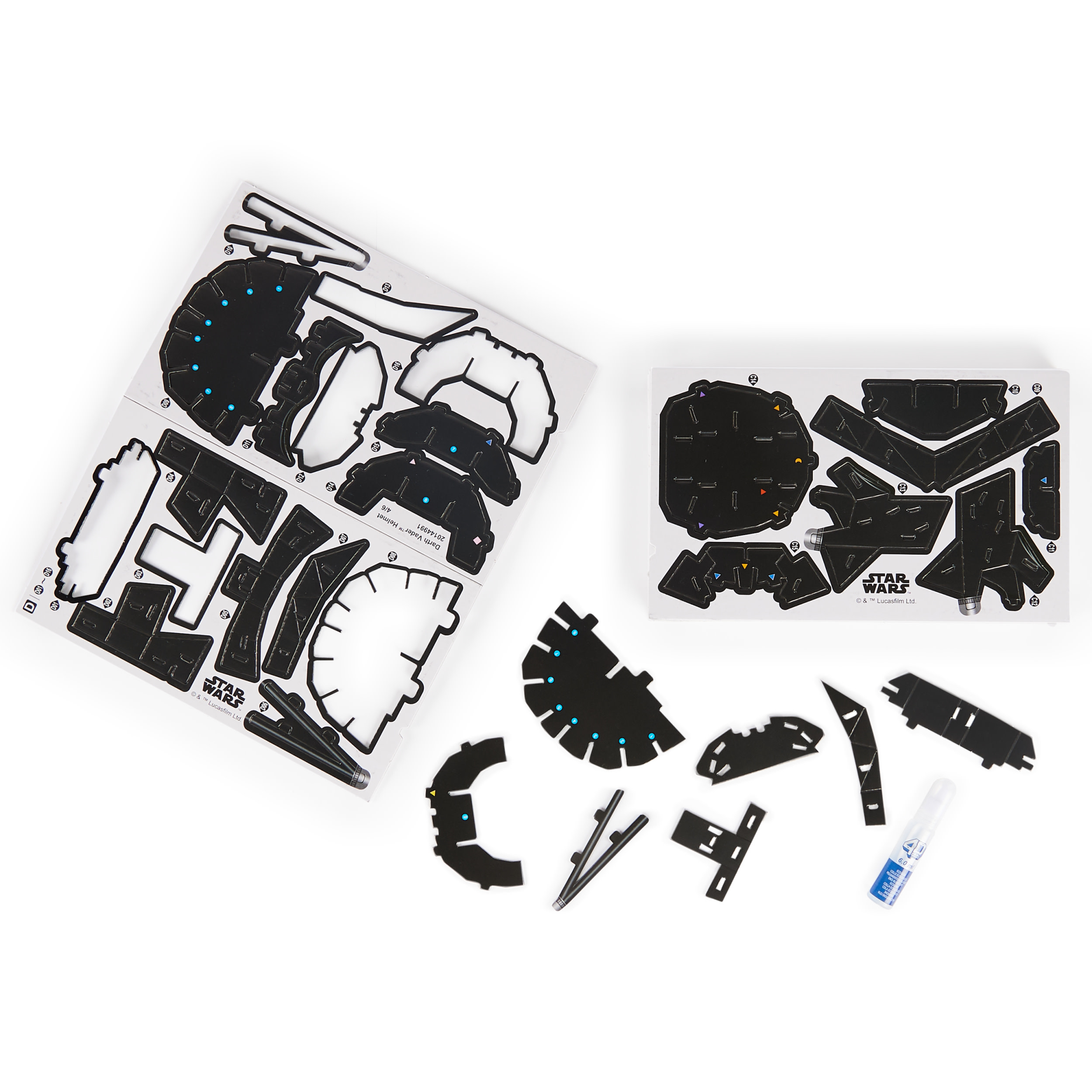 Darth Vader helmet puzzle pieces, unassembled, with glue and Star Wars logo.