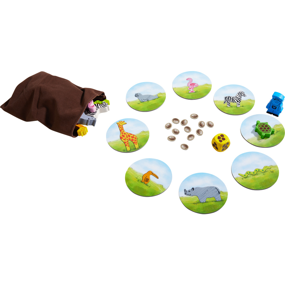 Ein Kinderspiel mit Tier-Spielsteinen, Würfeln und Spielbrettern, die Naturszenen zeigen.