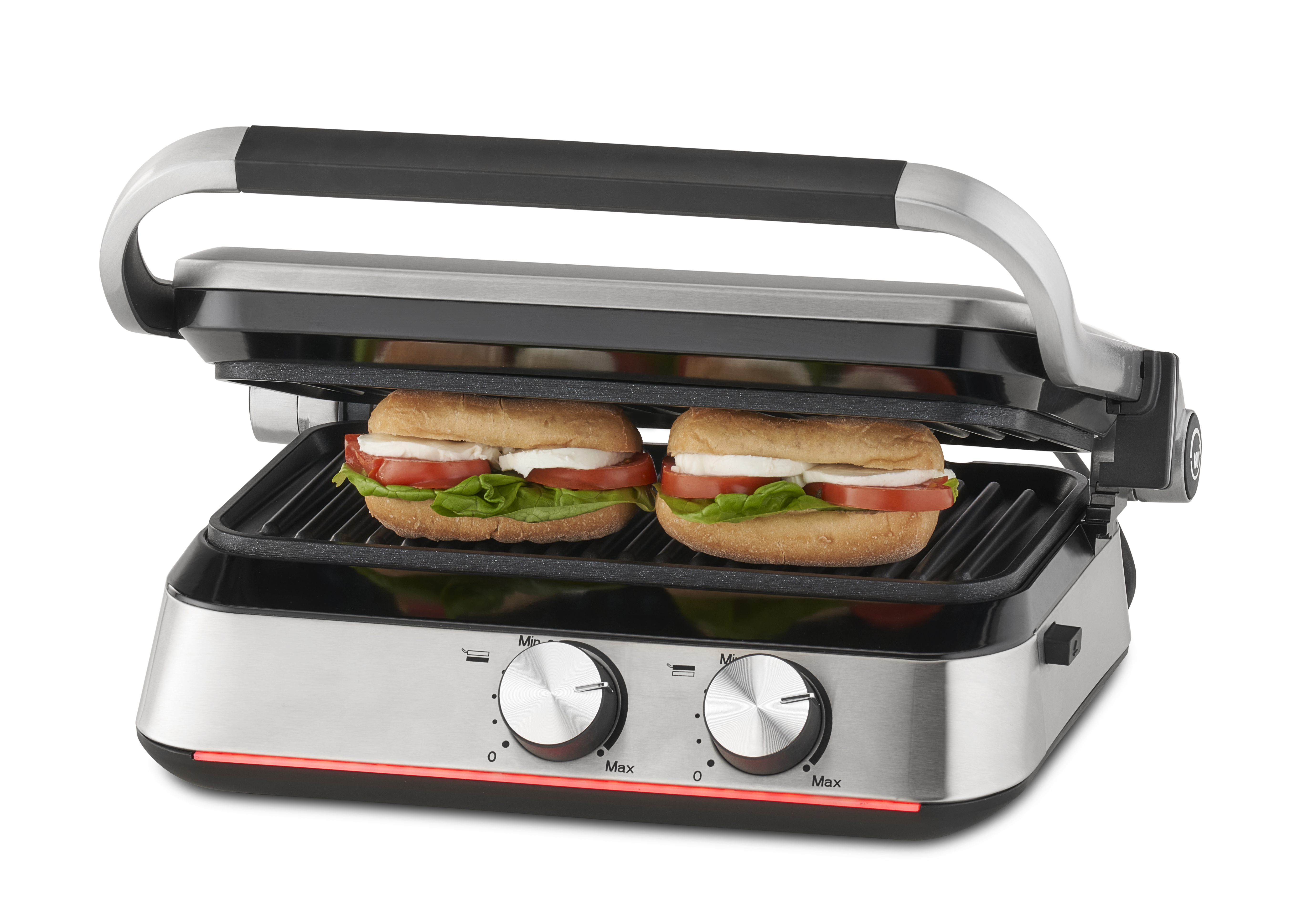 Silber-schwarze Panini-Presse mit zwei Sandwiches mit Tomaten und Salat. Knöpfe vorne.